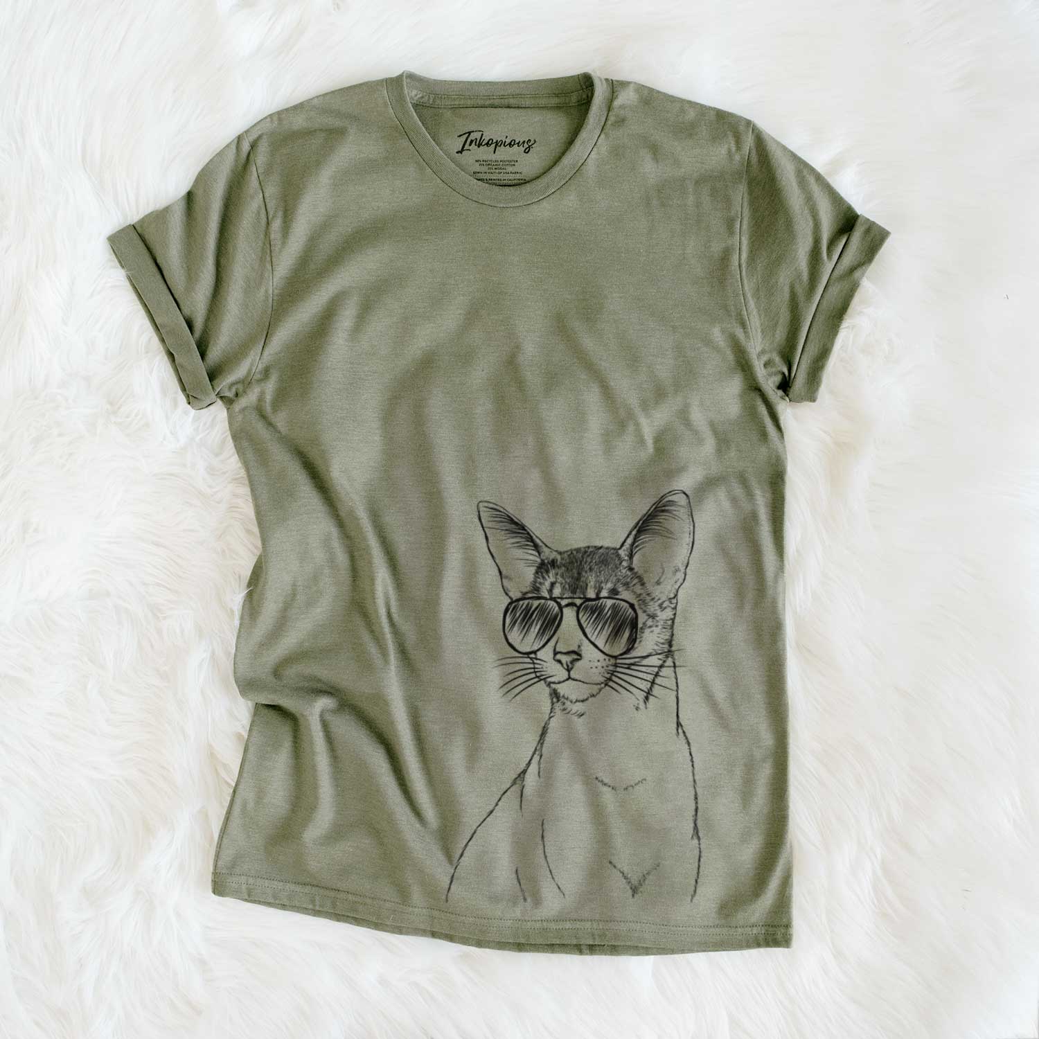 Hand-drawn sketch of Cedric the Abyssinian Cat wearing aviator sunglasses on an Olive Unisex crewneck