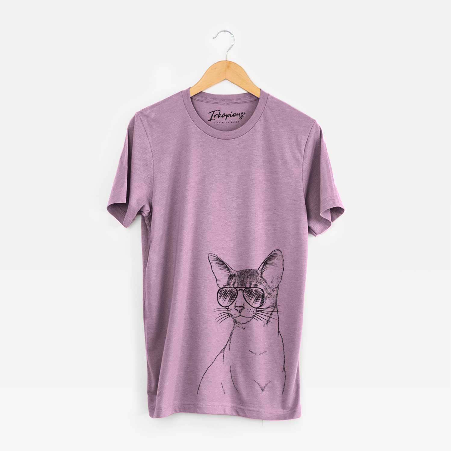Hand-drawn sketch of Cedric the Abyssinian Cat wearing aviator sunglasses on an Orchid Unisex crewneck