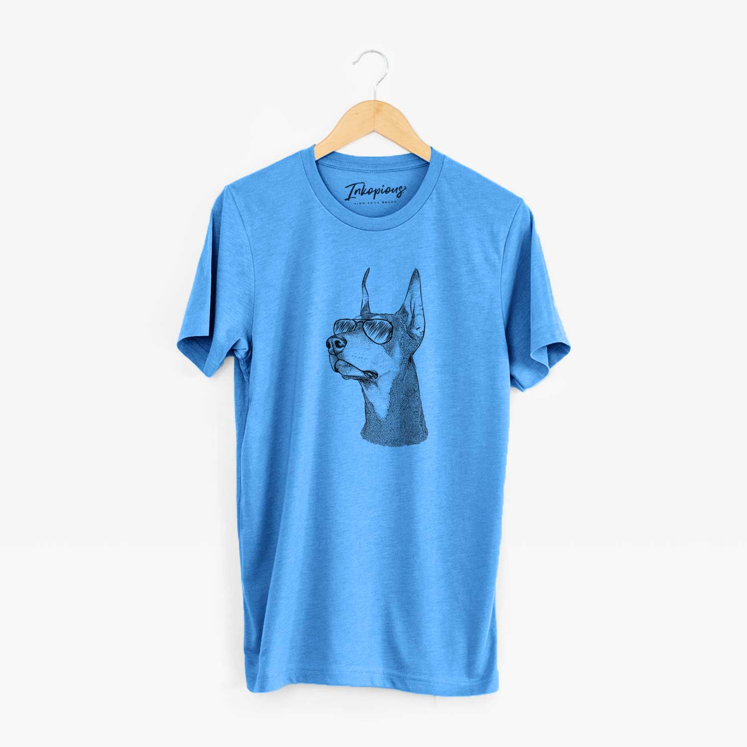 Hand-drawn sketch of Cenza the Doberman Pinscher wearing aviator sunglasses on a Blue Unisex crewneck