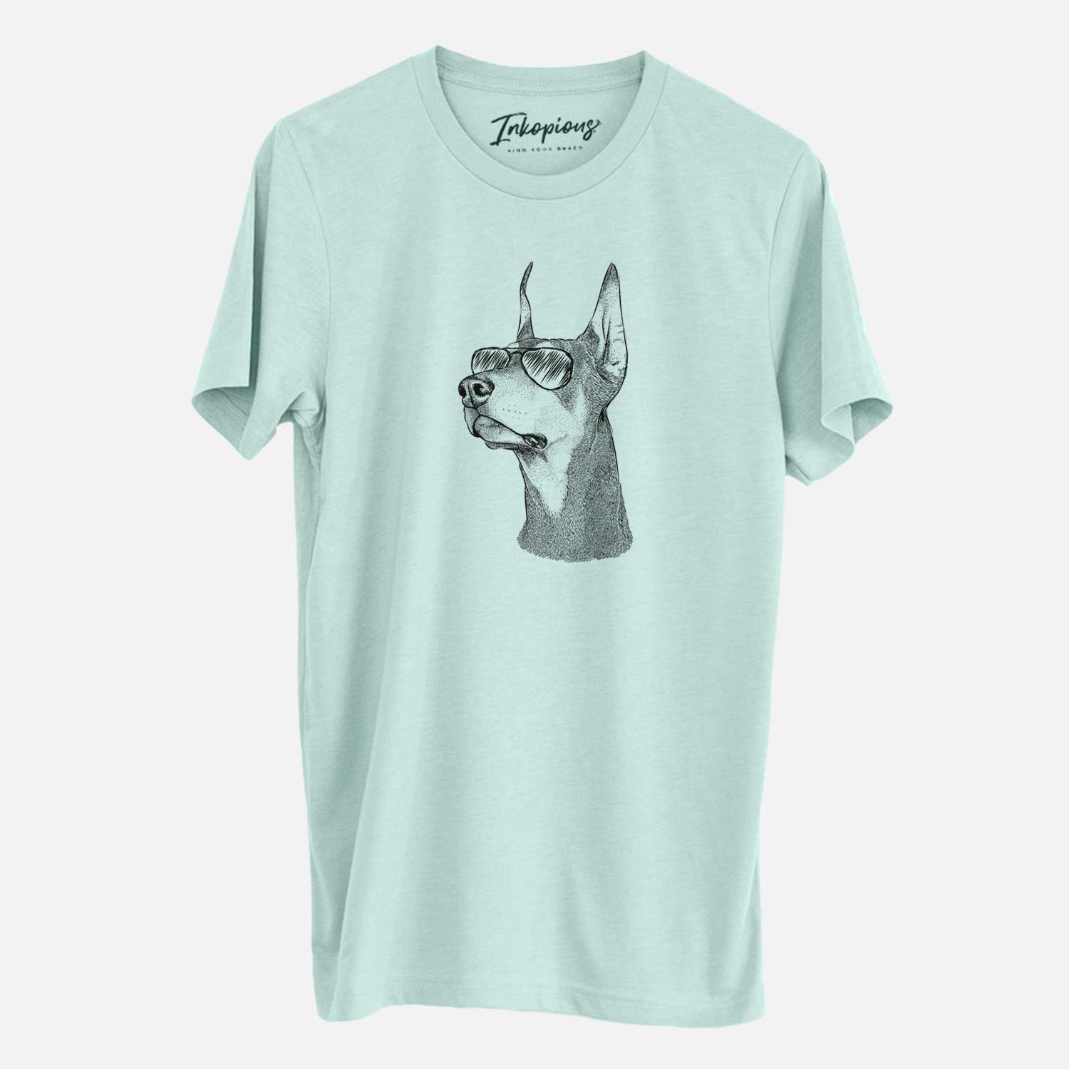 Hand-drawn sketch of Cenza the Doberman Pinscher wearing aviator sunglasses on a Heather Sage Unisex crewneck