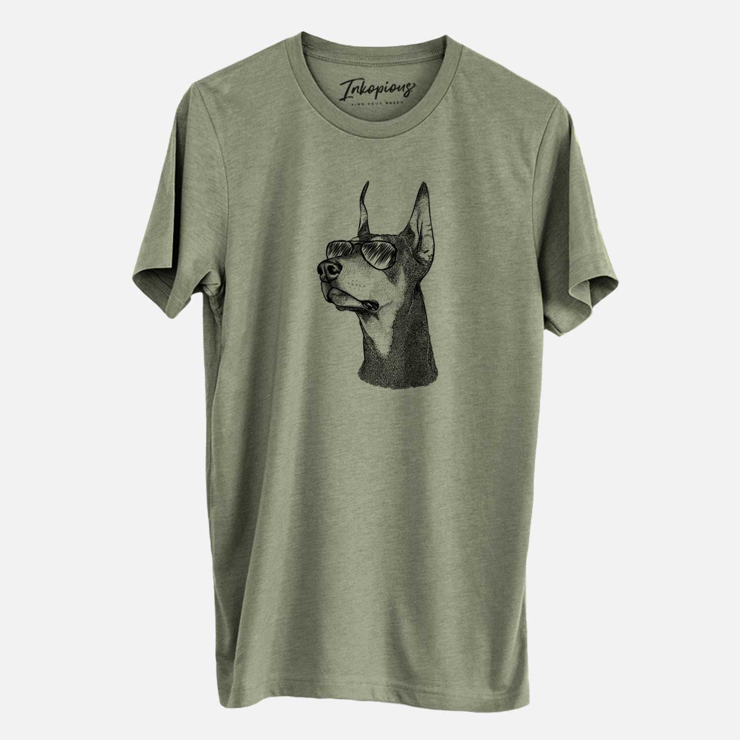 Hand-drawn sketch of Cenza the Doberman Pinscher wearing aviator sunglasses on an Olive Unisex crewneck