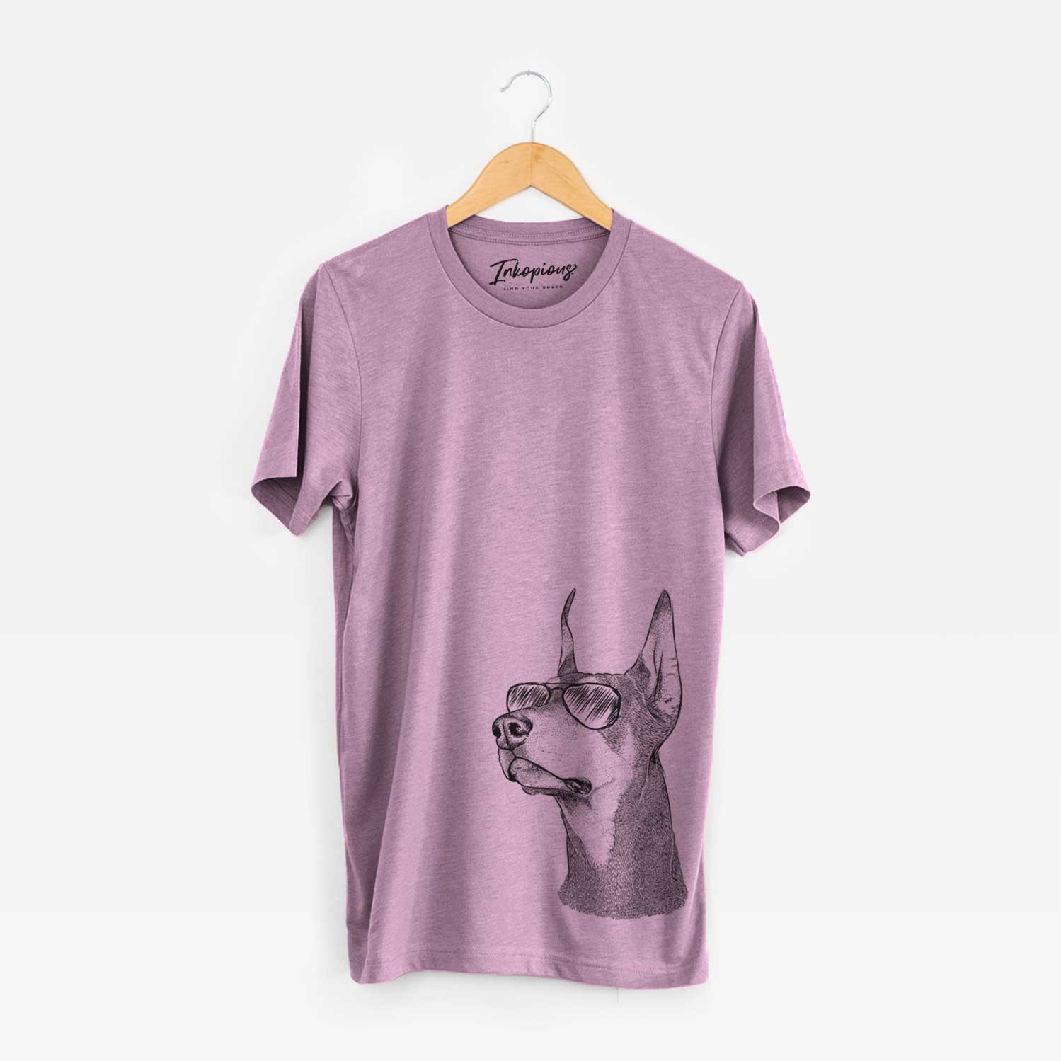 Hand-drawn sketch of Cenza the Doberman Pinscher wearing aviator sunglasses on an Orchid Unisex crewneck