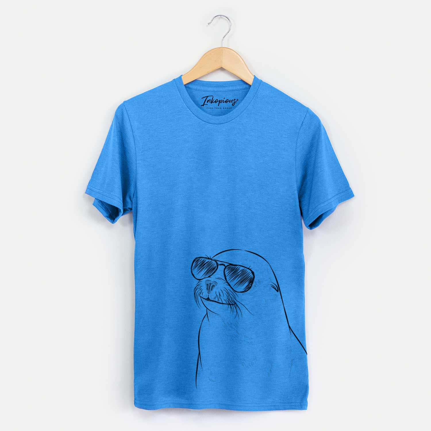 Hand-drawn sketch of Chip the California Sea Lion wearing aviator sunglasses on a Blue Unisex crewneck