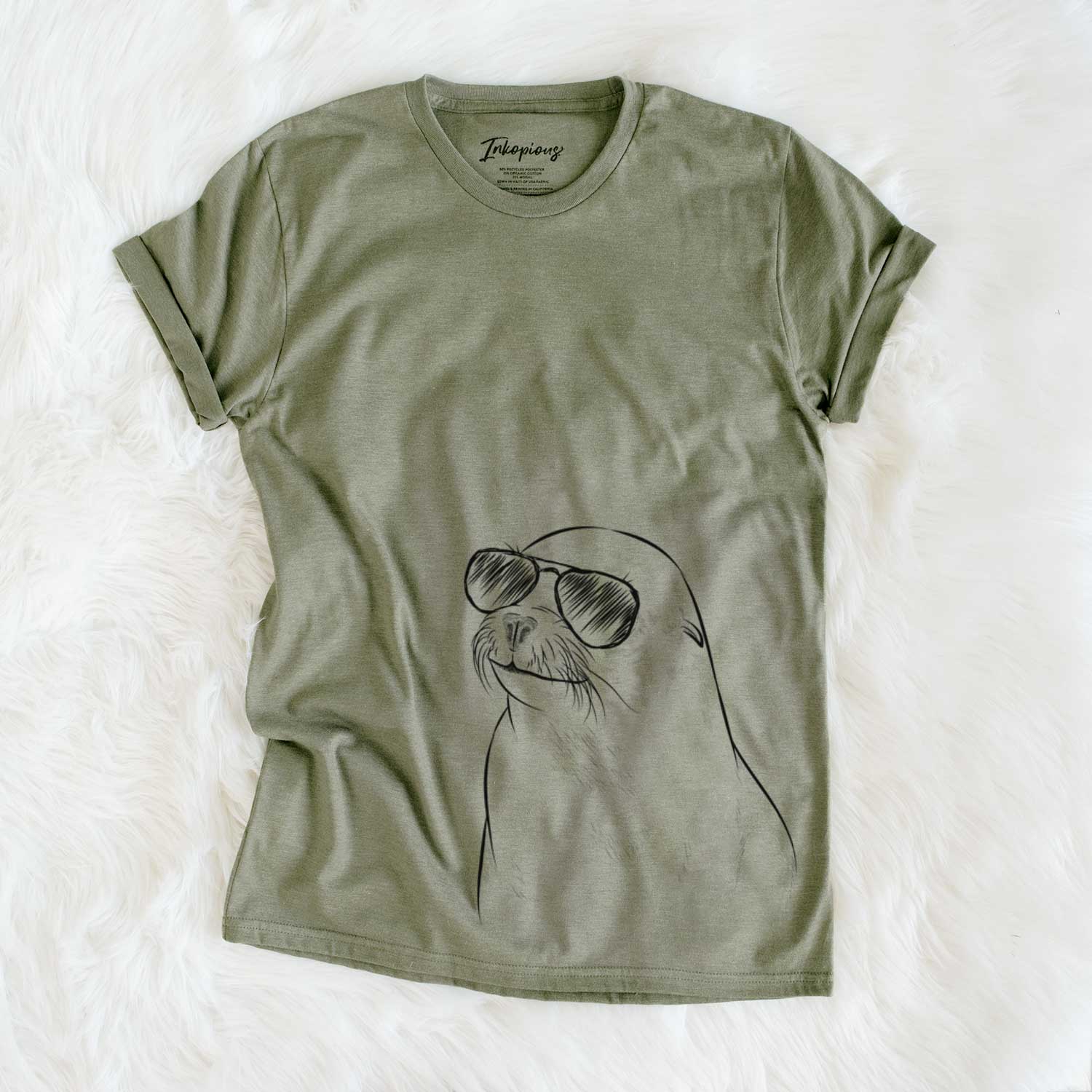 Hand-drawn sketch of Chip the California Sea Lion wearing aviator sunglasses on an Olive Unisex crewneck