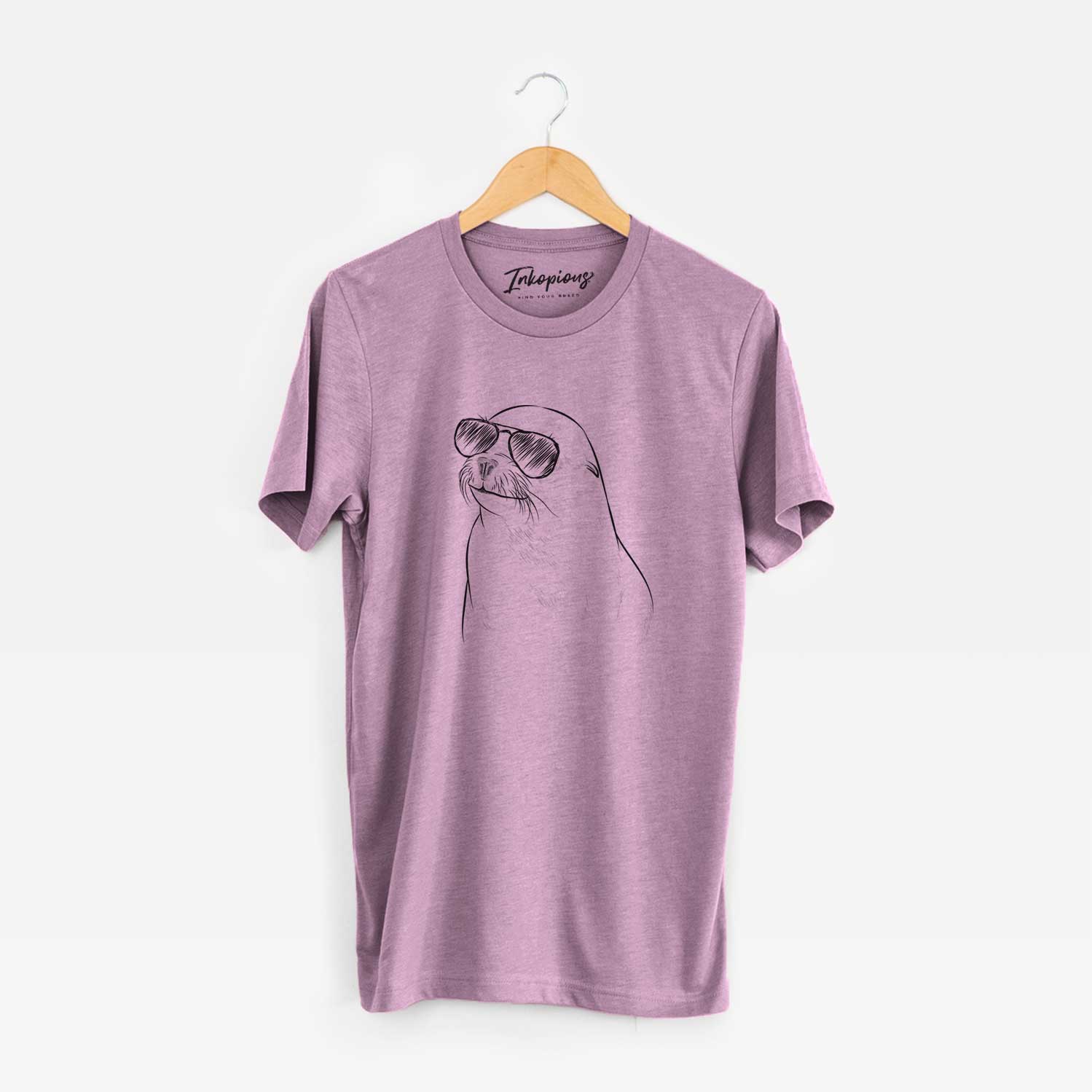 Hand-drawn sketch of Chip the California Sea Lion wearing aviator sunglasses on an Orchid Unisex crewneck