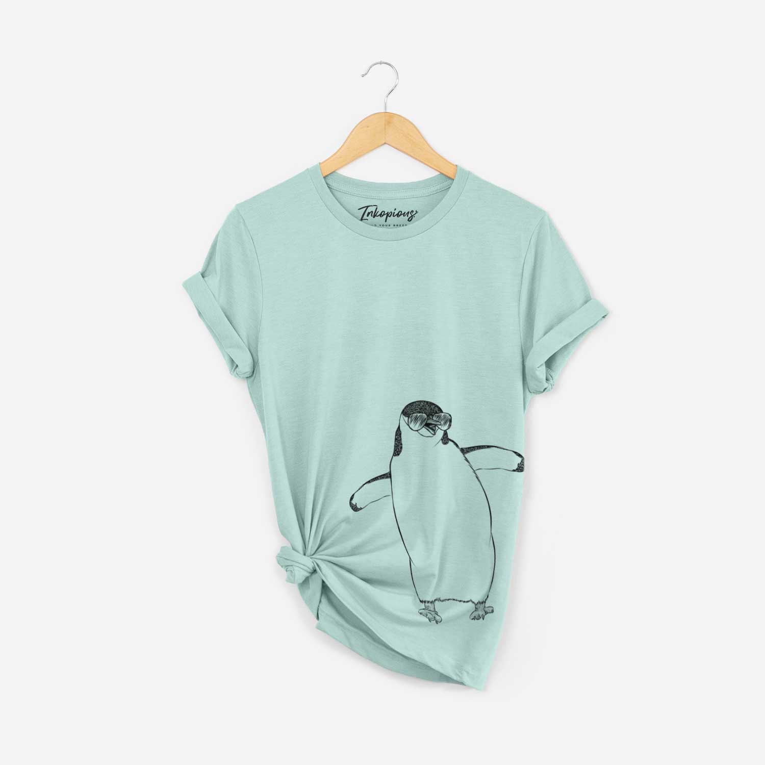 Hand-drawn sketch of Chive the Chinstrap Penguin wearing aviator sunglasses on a Heather Sage Bella Canvas Unisex Crewneck