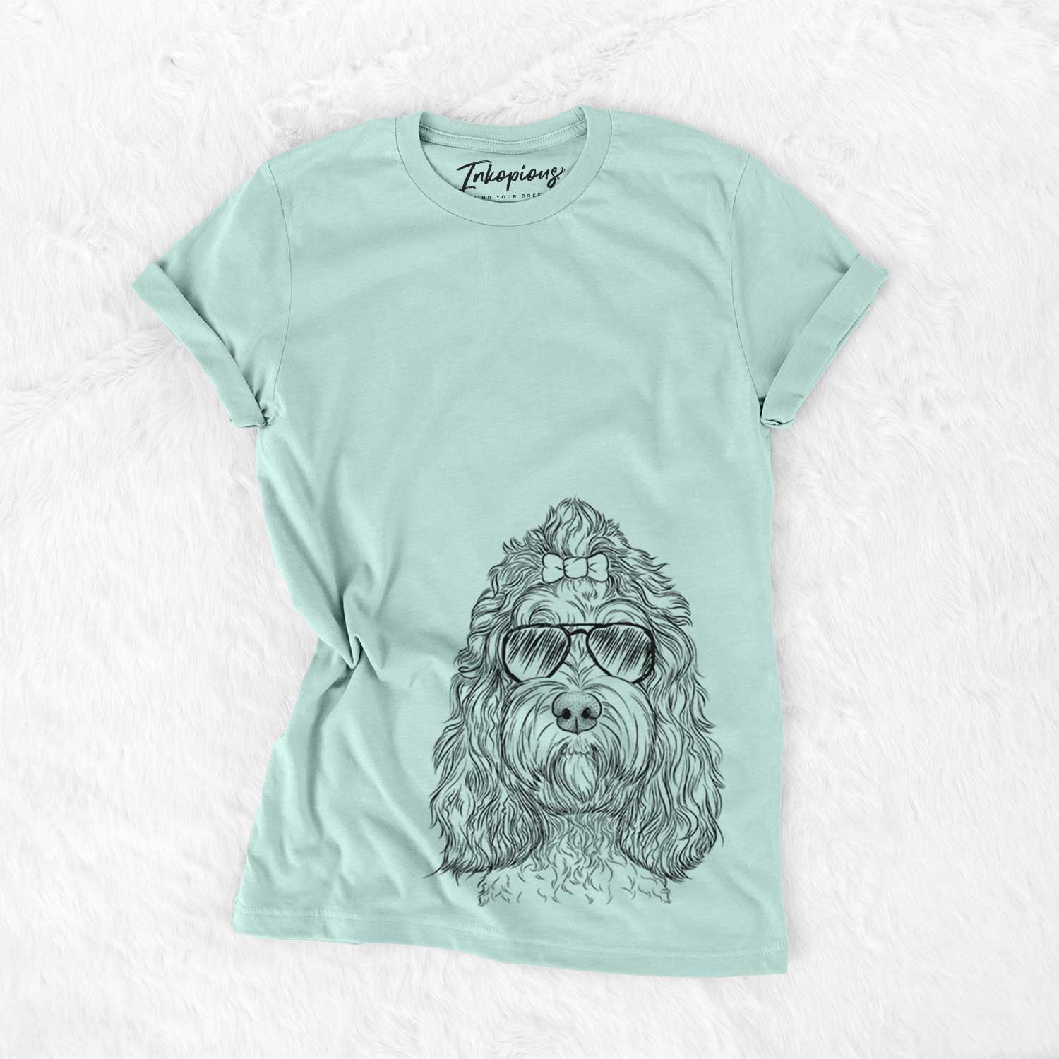 Hand-drawn sketch of Chloe the Cockapoo wearing aviator sunglasses on a Heather Sage Unisex crewneck