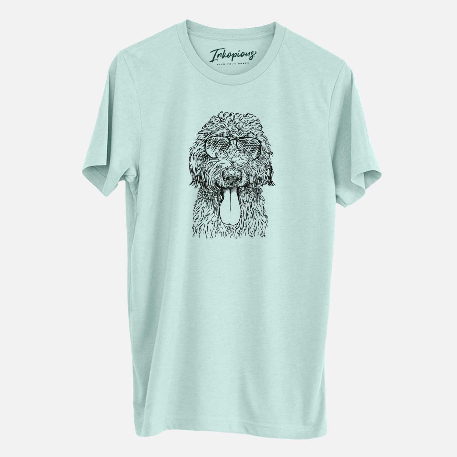 Hand-drawn sketch of CiCi Paulk the Aussiedoodle wearing aviator sunglasses on a Heather Sage Unisex crewneck