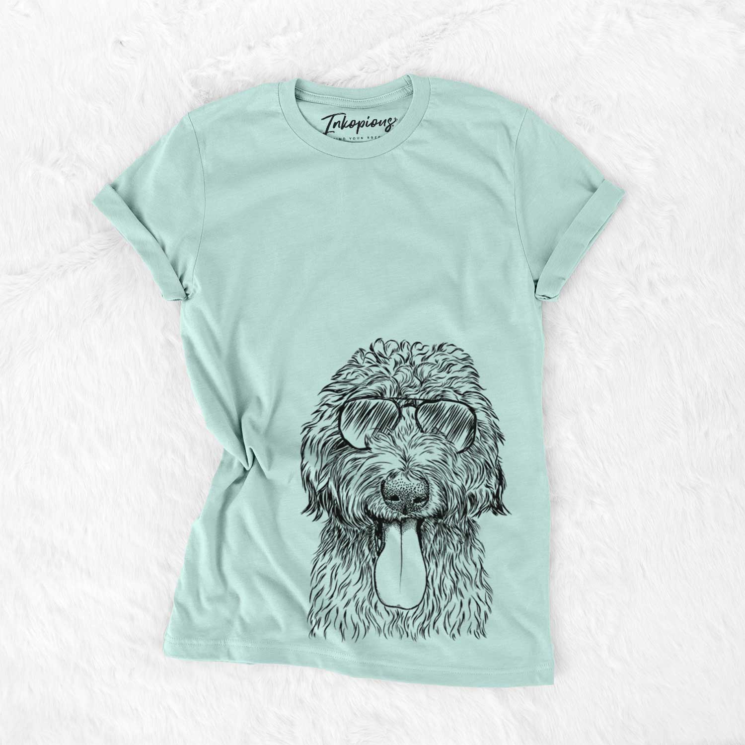 Hand-drawn sketch of CiCi Paulk the Aussiedoodle wearing aviator sunglasses on a Heather Sage Unisex crewneck