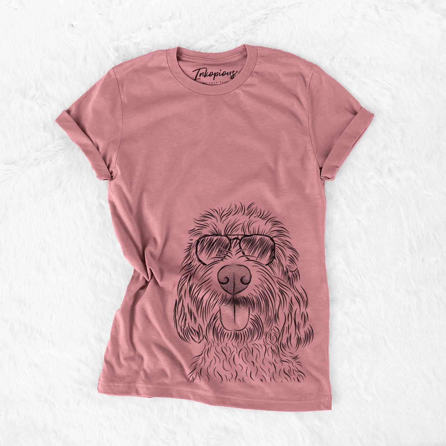Hand-drawn sketch of Clover the Cockapoo wearing aviator sunglasses on a Mauve Unisex crewneck