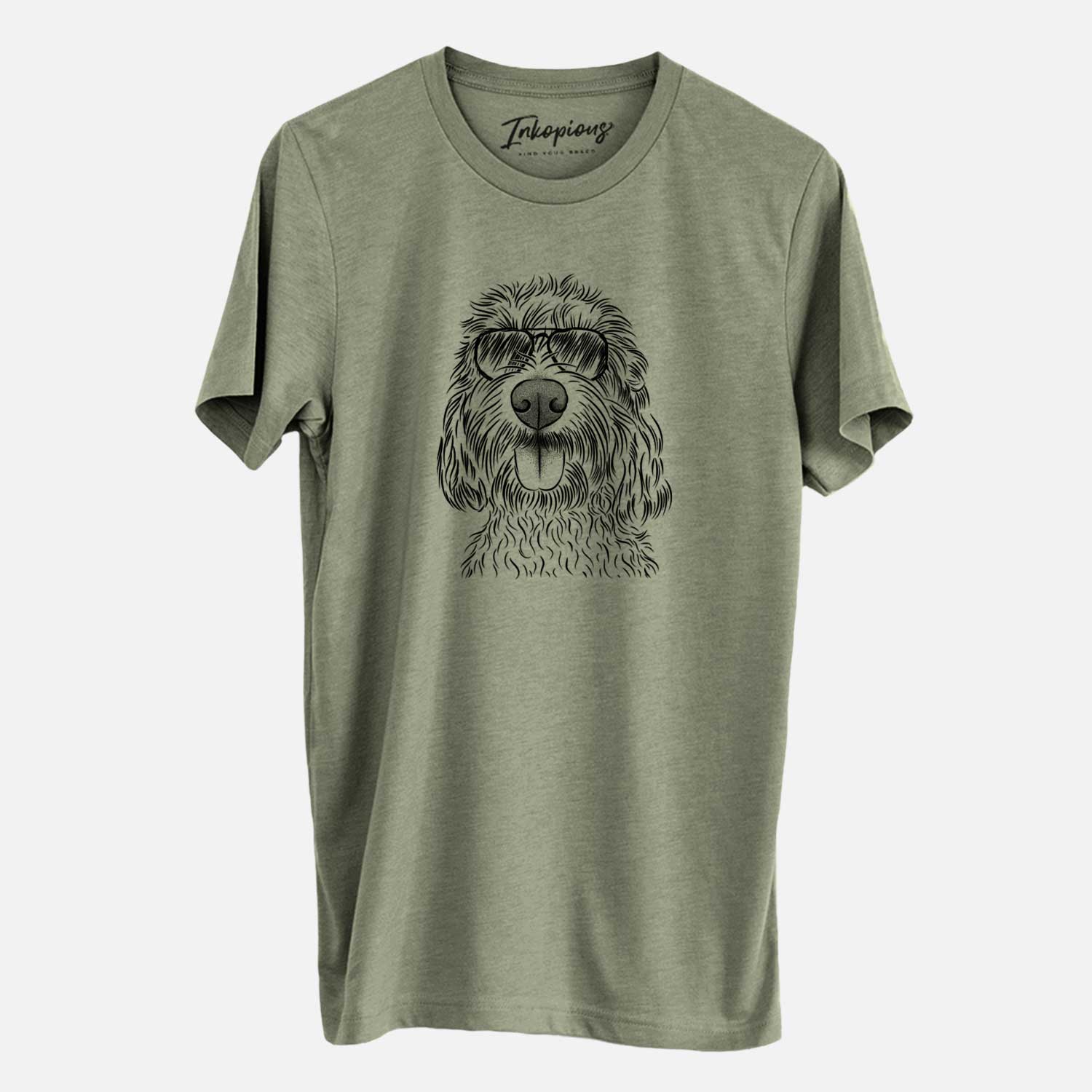 Hand-drawn sketch of Clover the Cockapoo wearing aviator sunglasses on an Olive Unisex crewneck