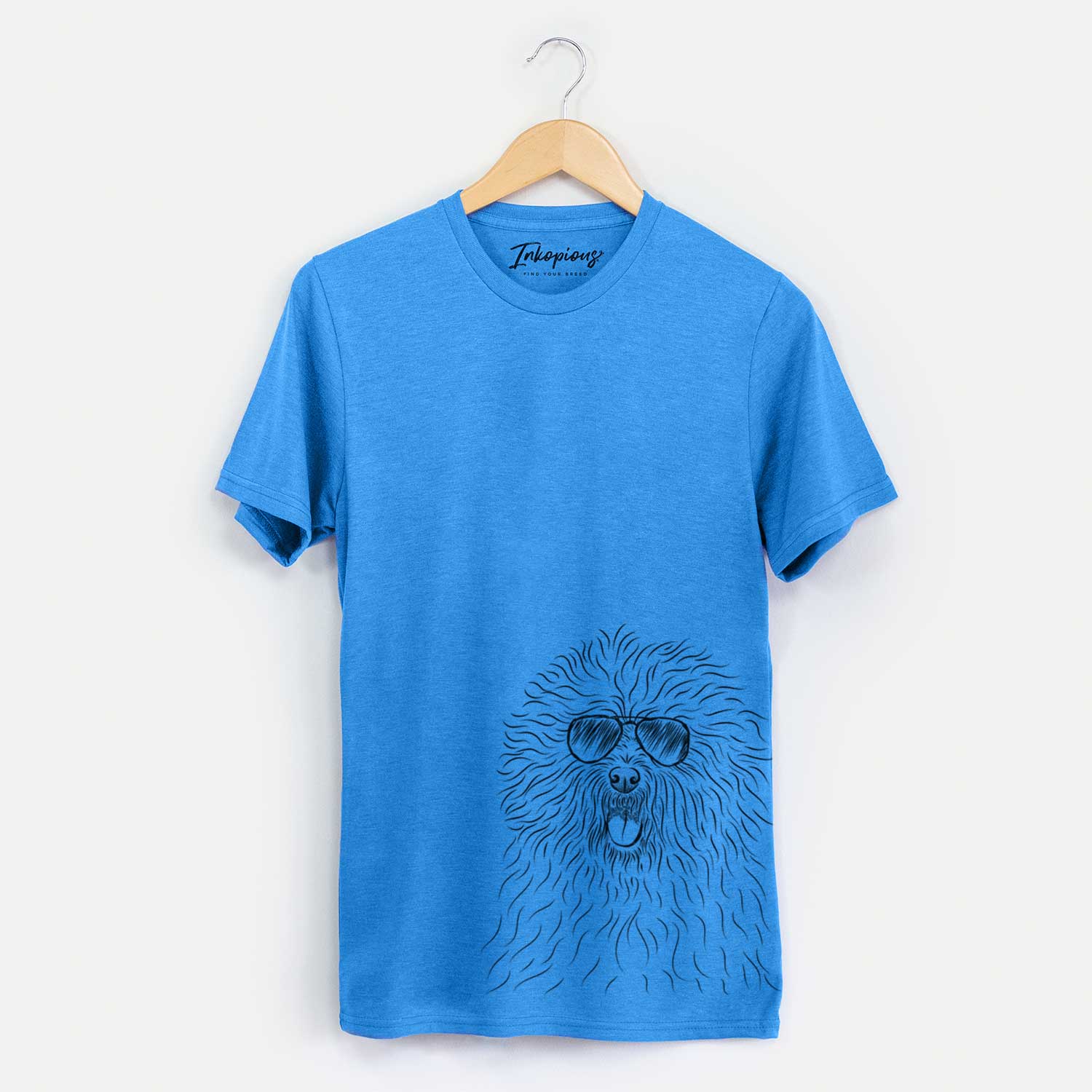 Hand-drawn sketch of Cozie the Old English Sheepdog wearing aviator sunglasses on a Blue Unisex crewneck