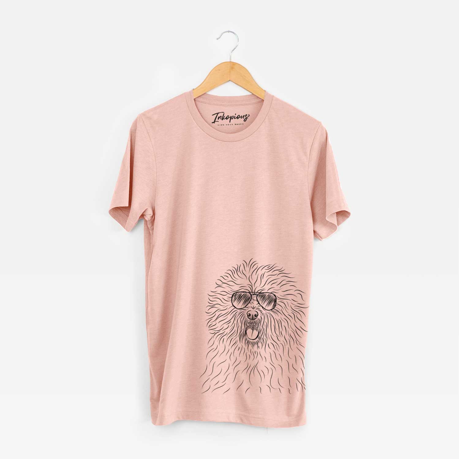 Hand-drawn sketch of Cozie the Old English Sheepdog wearing aviator sunglasses on a Peach Unisex crewneck