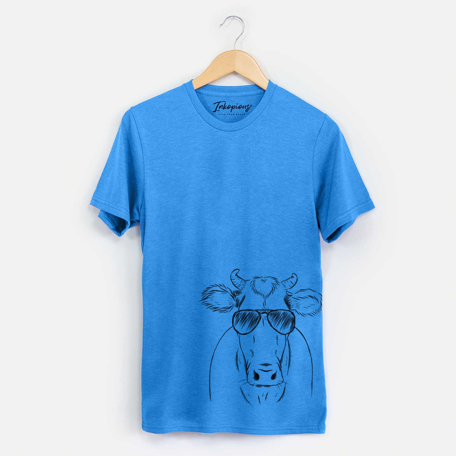 Hand-drawn sketch of Cruz the Cow wearing aviator sunglasses on a Blue Unisex crewneck