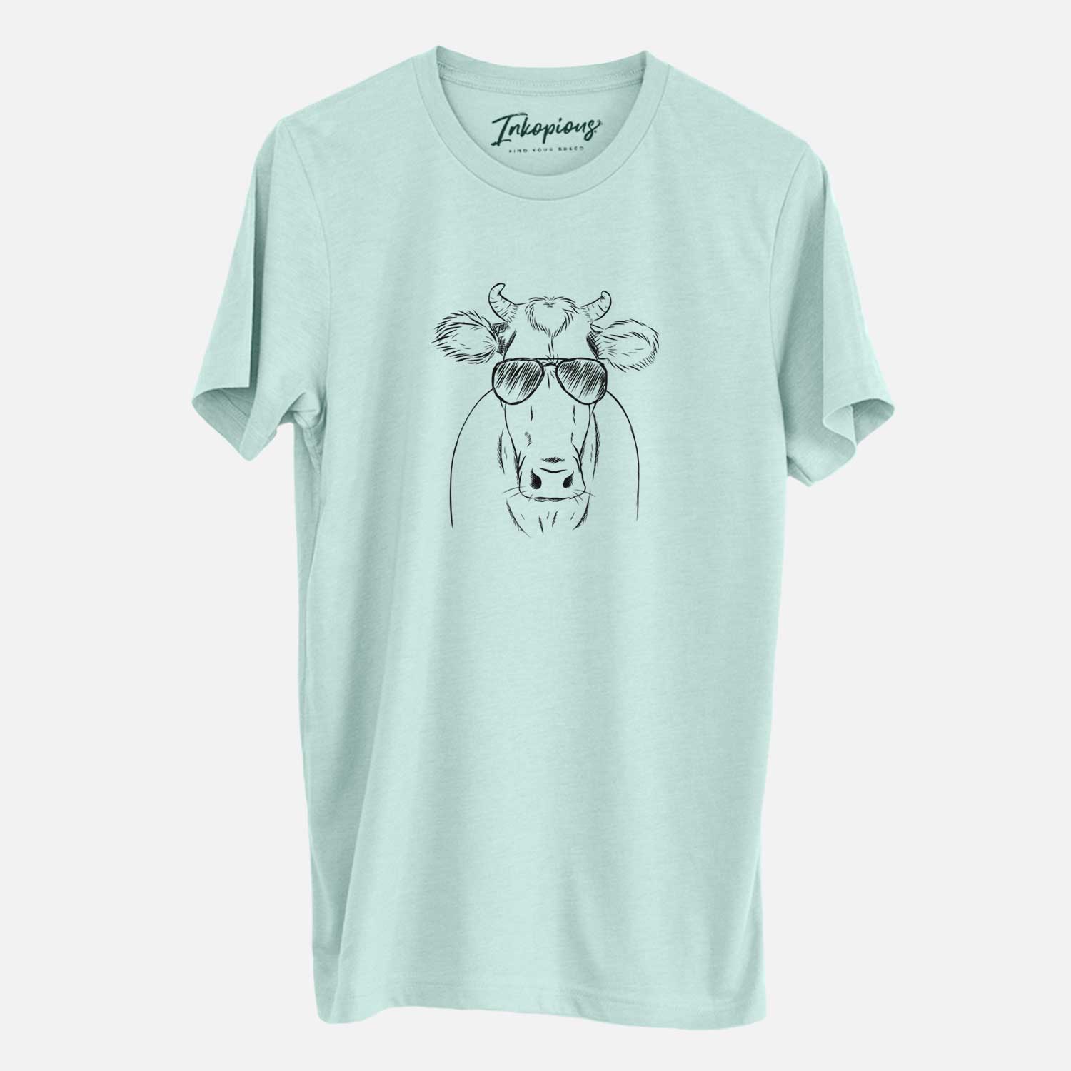 Hand-drawn sketch of Cruz the Cow wearing aviator sunglasses on a Heather Sage Unisex crewneck