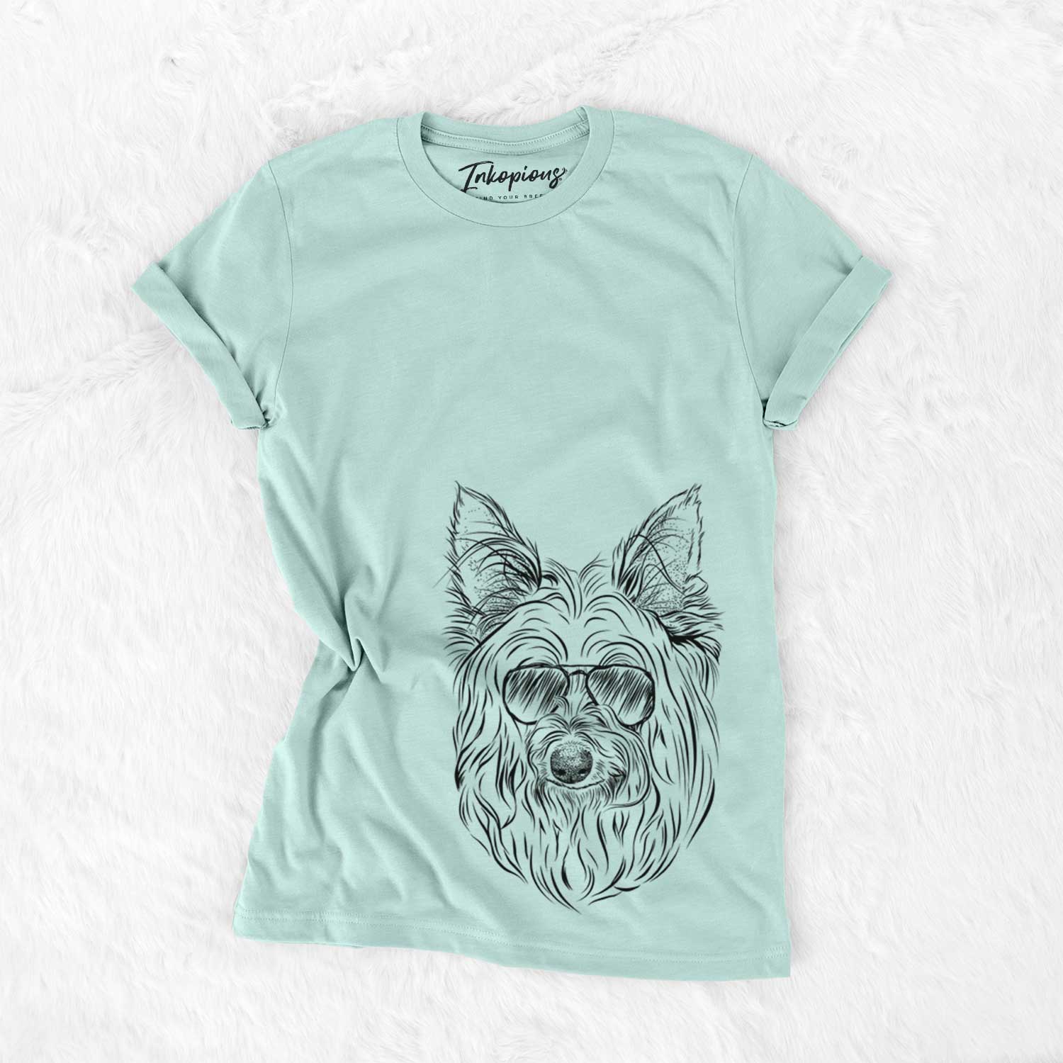 Hand-drawn sketch of Daisy May the Silky Terrier wearing aviator sunglasses on a Heather Sage Unisex crewneck