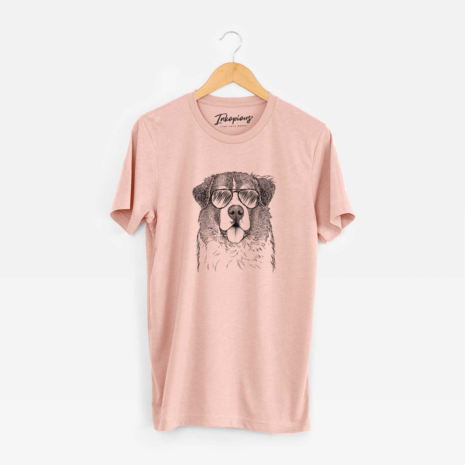 Hand-drawn sketch of Dilly the Saint Bernard wearing aviator sunglasses on a Peach Unisex crewneck