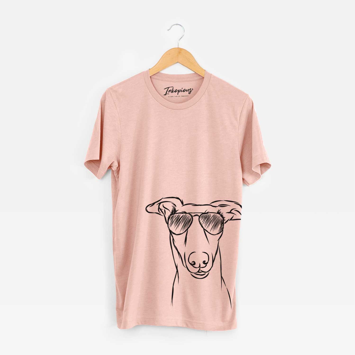 Hand-drawn sketch of Diva the Greyhound wearing aviator sunglasses on a Peach Bella Canvas Unisex Crewneck
