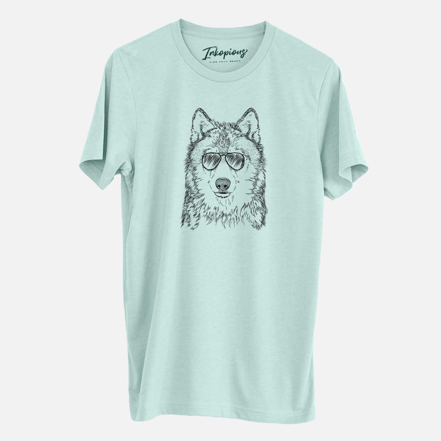 Hand-drawn sketch of Django the Grey Wolf wearing aviator sunglasses on a Heather Sage Unisex crewneck