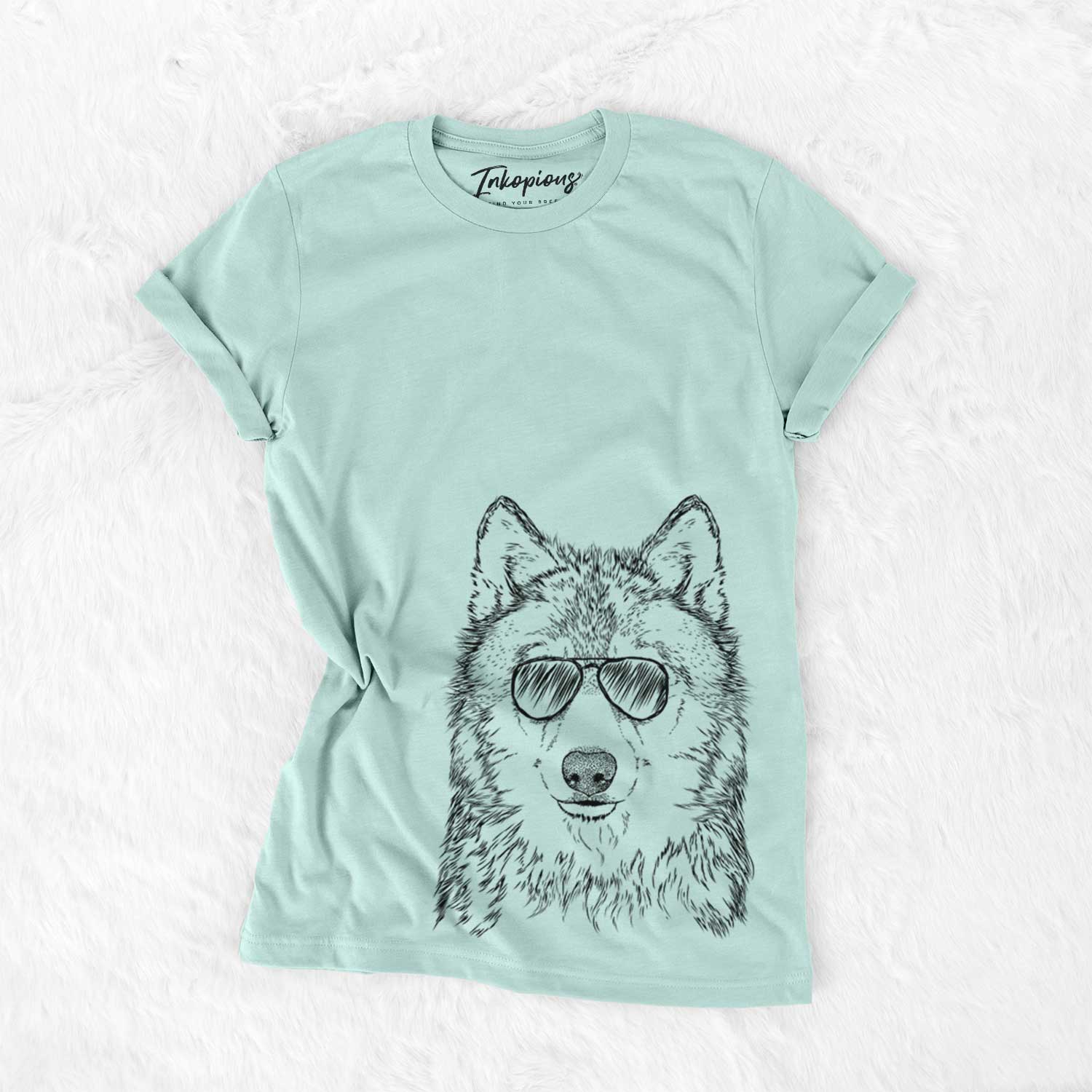 Hand-drawn sketch of Django the Grey Wolf wearing aviator sunglasses on a Heather Sage Unisex crewneck