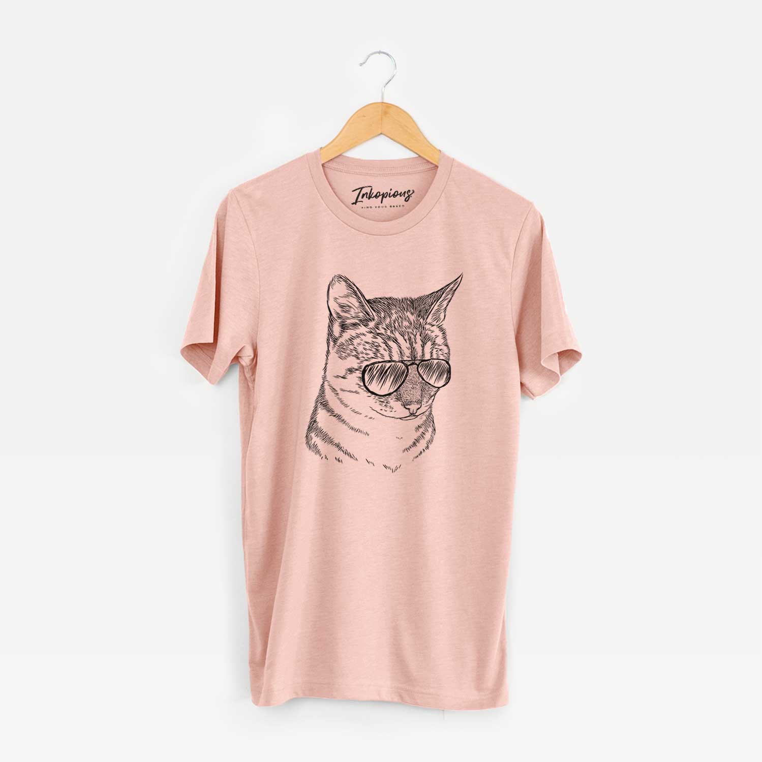 Hand-drawn sketch of Dora the Tabby Cat wearing aviator sunglasses on a Peach Unisex crewneck