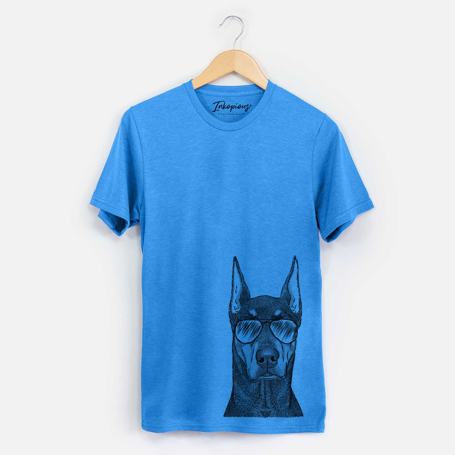 Hand-drawn sketch of Drake the Doberman Pinscher wearing aviator sunglasses on a Blue Unisex crewneck