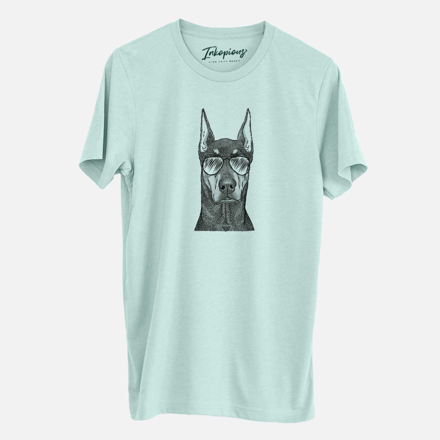 Hand-drawn sketch of Drake the Doberman Pinscher wearing aviator sunglasses on a Heather Sage Unisex crewneck