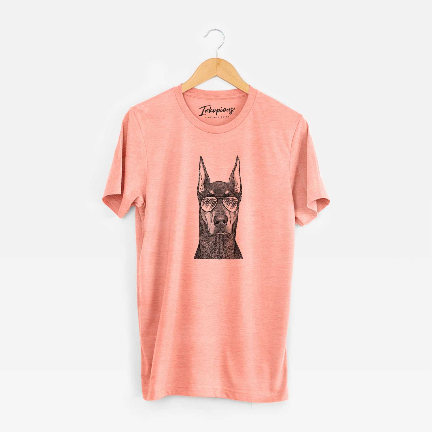 Hand-drawn sketch of Drake the Doberman Pinscher wearing aviator sunglasses on a Sunset Unisex crewneck