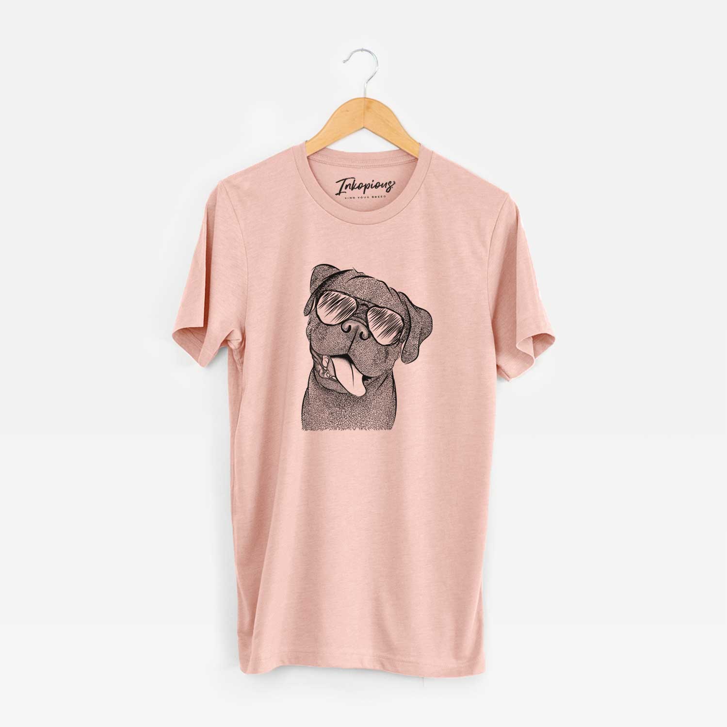 Hand-drawn sketch of Dudley Danger the Pug wearing aviator sunglasses on a Peach Unisex crewneck