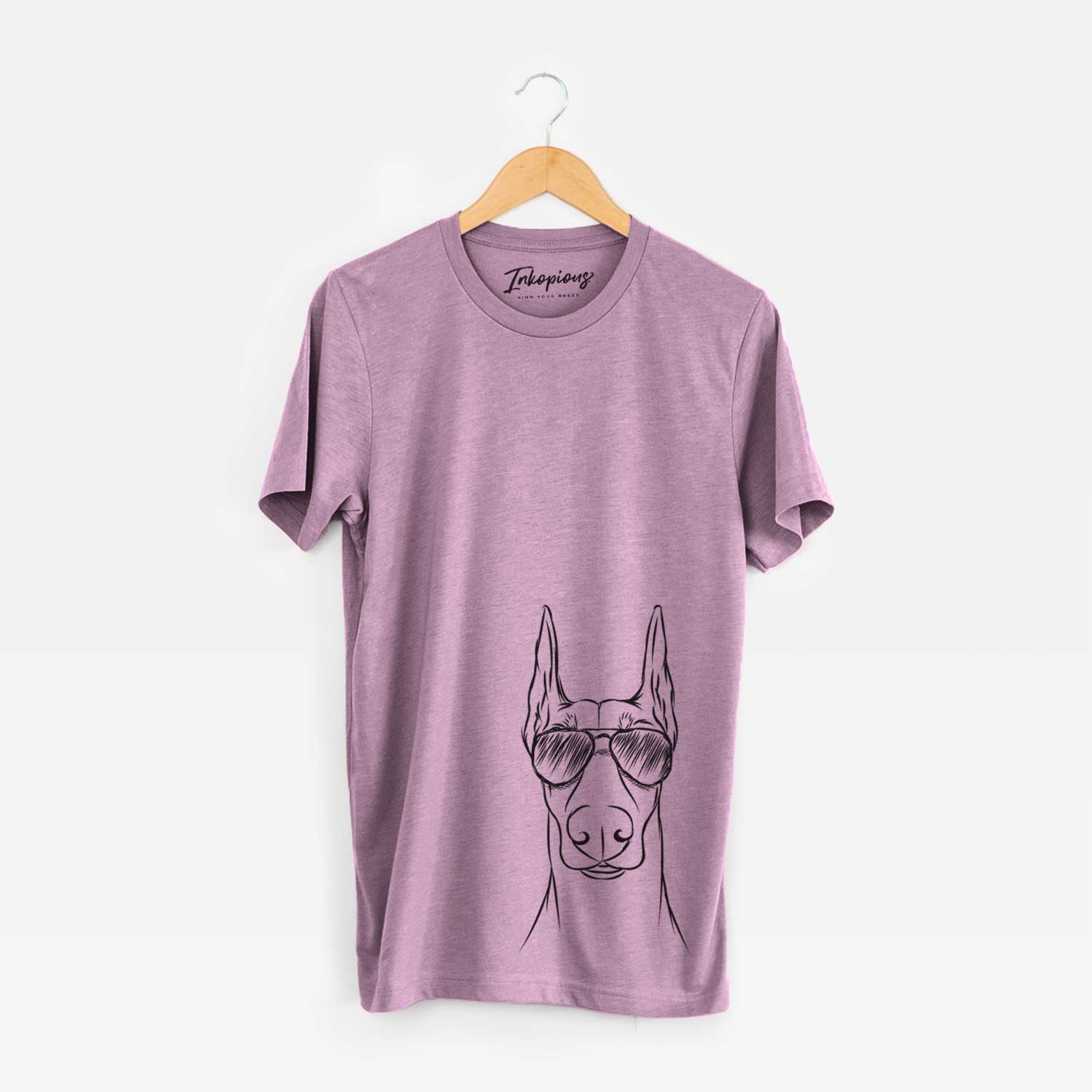 Hand-drawn sketch of Duke the Doberman Pinscher wearing aviator sunglasses on an Orchid Unisex crewneck