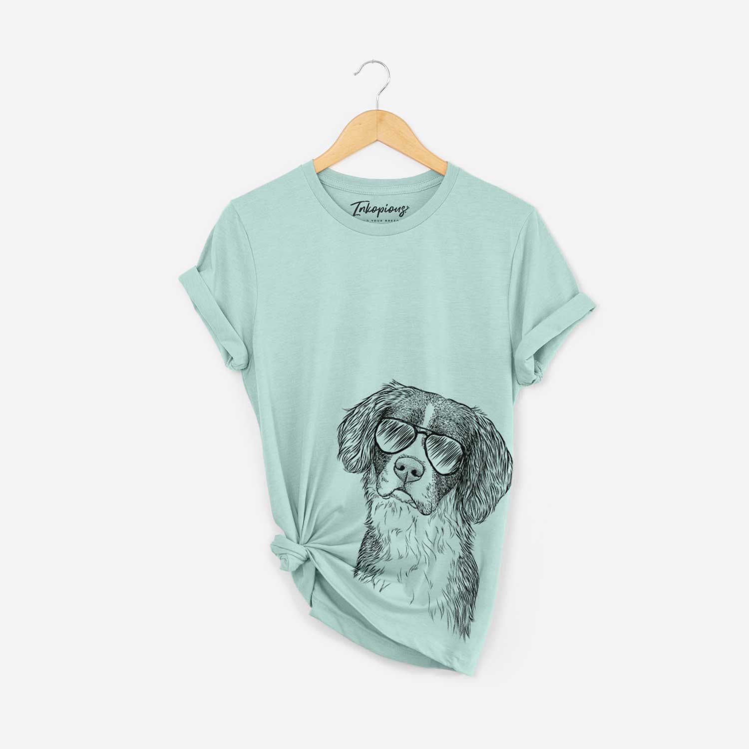 Hand-drawn sketch of Dulce the Drentsche Patrijshond wearing aviator sunglasses on a Heather Sage Bella Canvas Unisex Crewneck