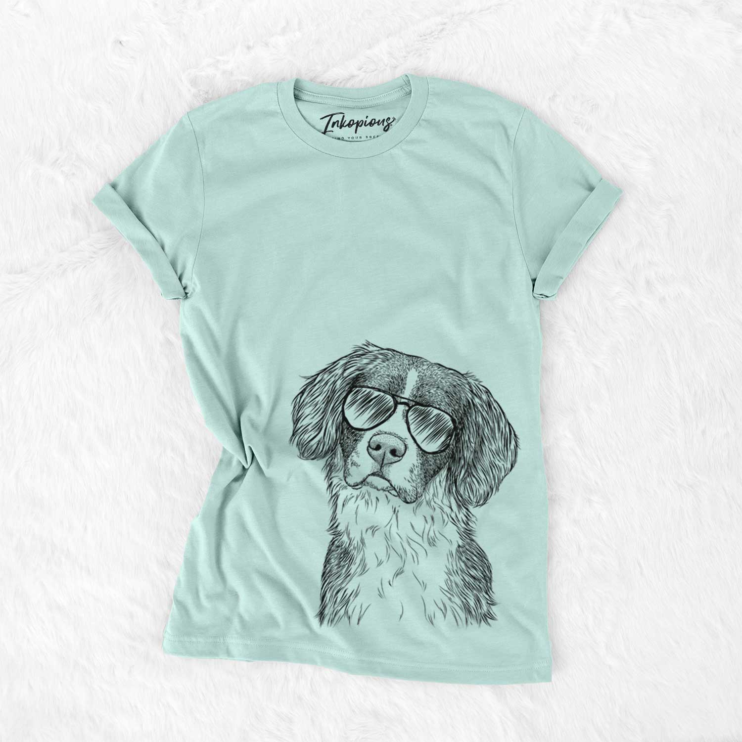 Hand-drawn sketch of Dulce the Drentsche Patrijshond wearing aviator sunglasses on a Heather Sage Unisex crewneck