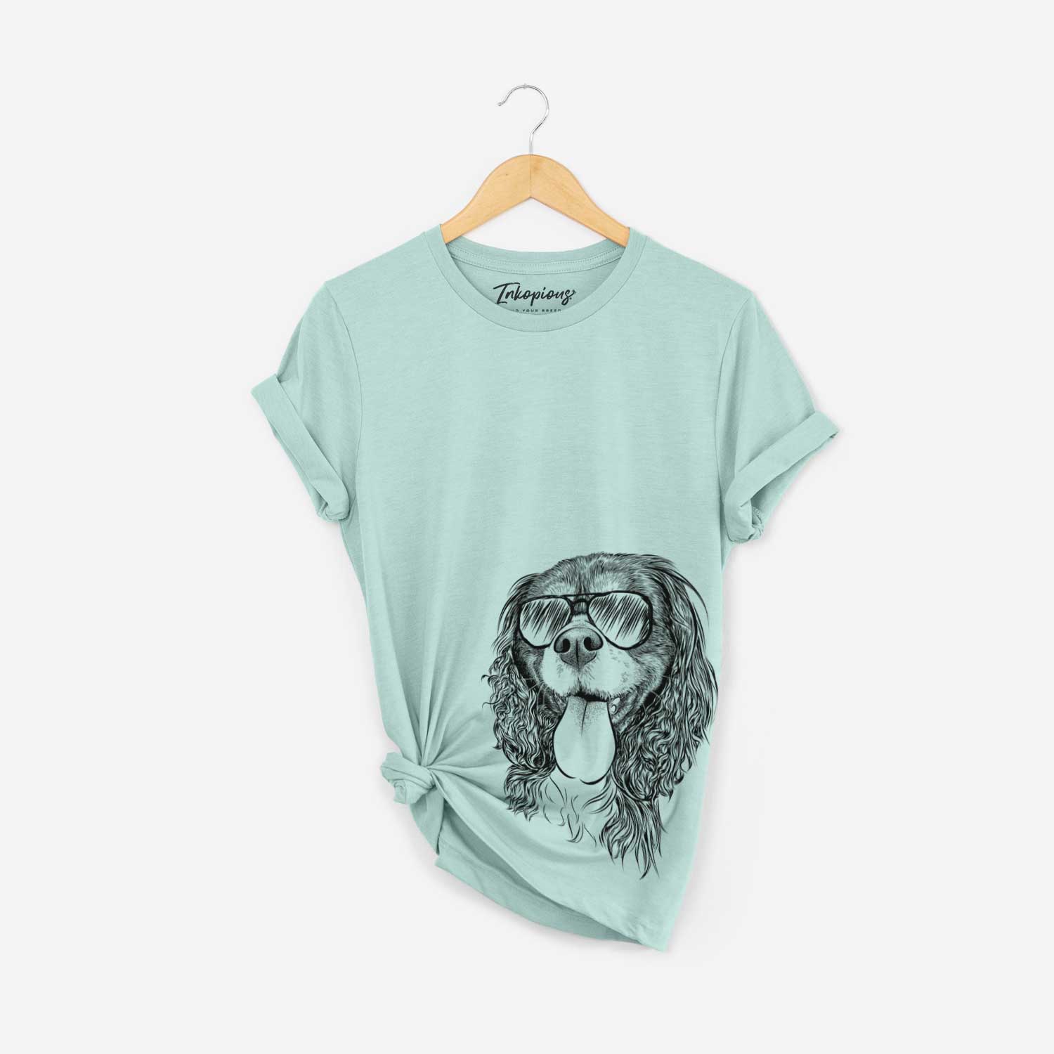 Hand-drawn sketch of Elizabeth the Cavalier King Charles Spaniel wearing aviator sunglasses on a Heather Sage Bella Canvas Unisex Crewneck