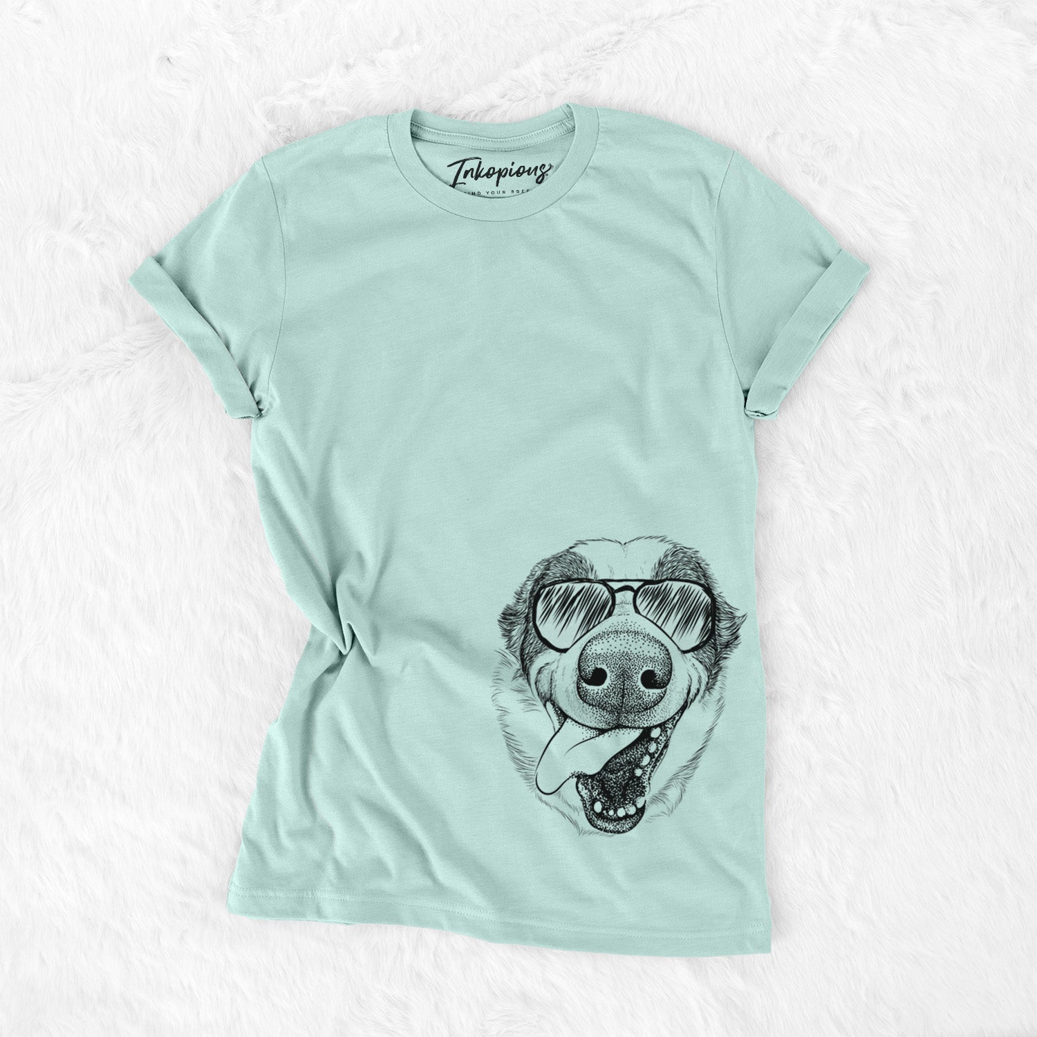 Hand-drawn sketch of Elwood the Border Collie wearing aviator sunglasses on a Heather Sage Unisex crewneck