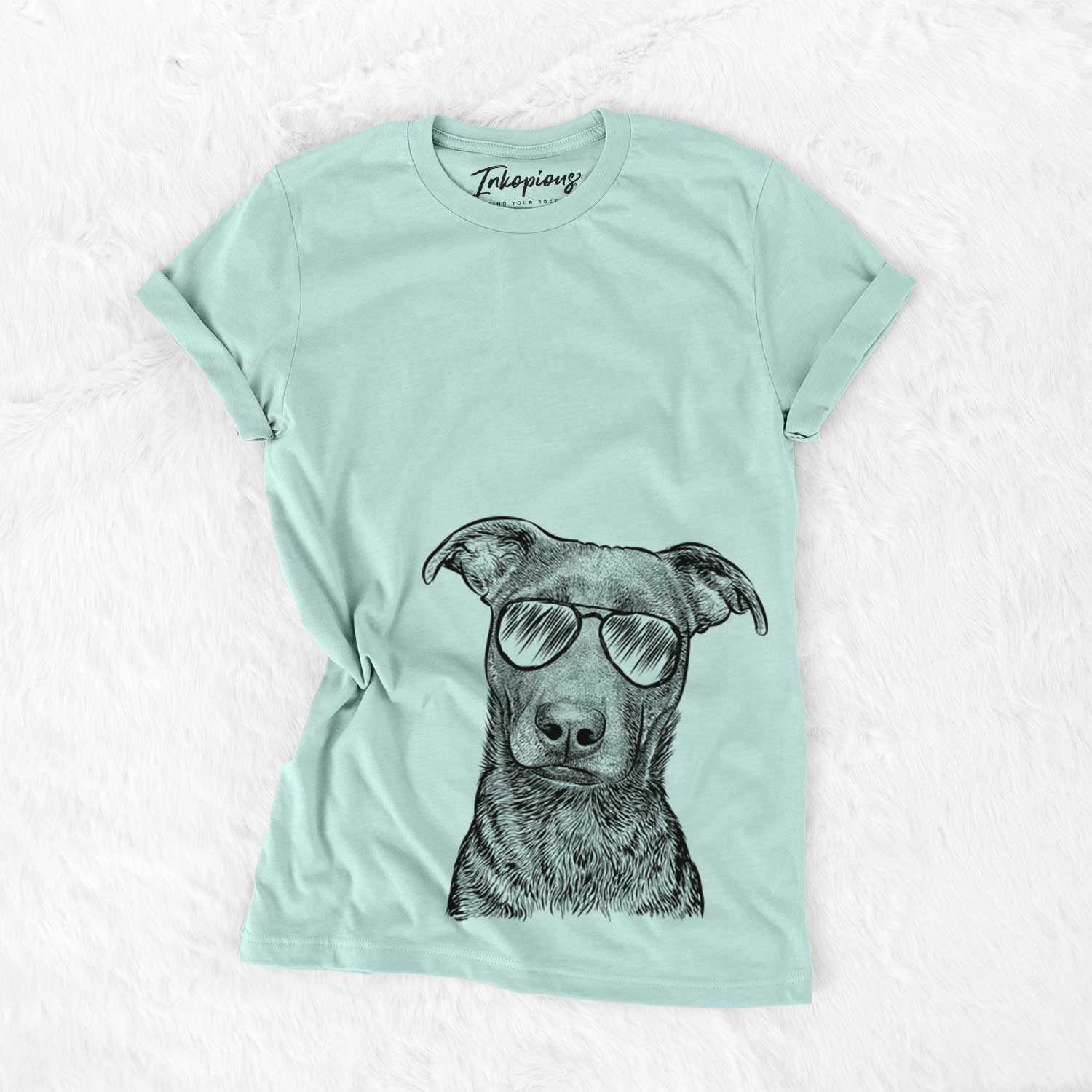 Hand-drawn sketch of Embyr the Mixed Breed wearing aviator sunglasses on a Heather Sage Unisex crewneck