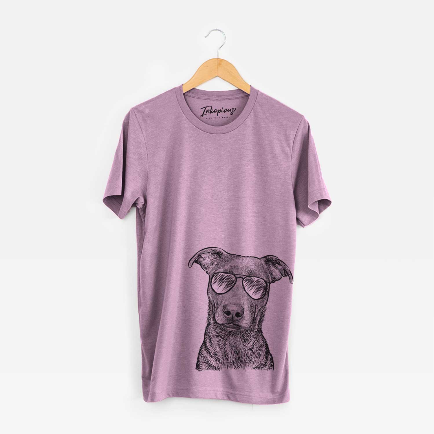 Hand-drawn sketch of Embyr the Mixed Breed wearing aviator sunglasses on an Orchid Unisex crewneck