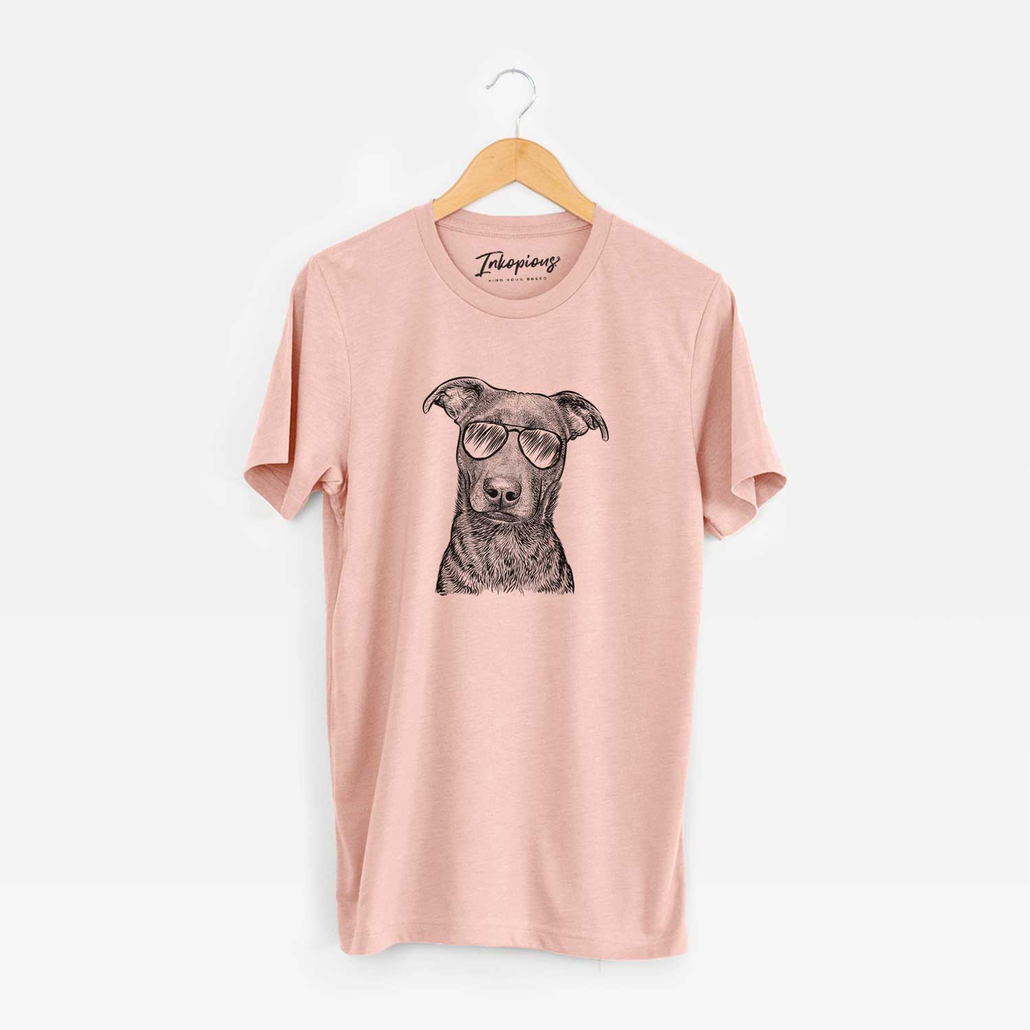 Hand-drawn sketch of Embyr the Mixed Breed wearing aviator sunglasses on a Peach Unisex crewneck