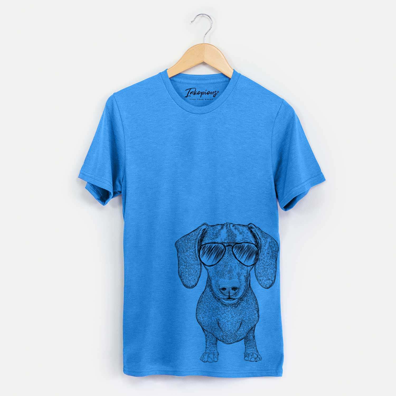 Hand-drawn sketch of Ernie the Mini Dachshund wearing aviator sunglasses on a Blue Unisex crewneck