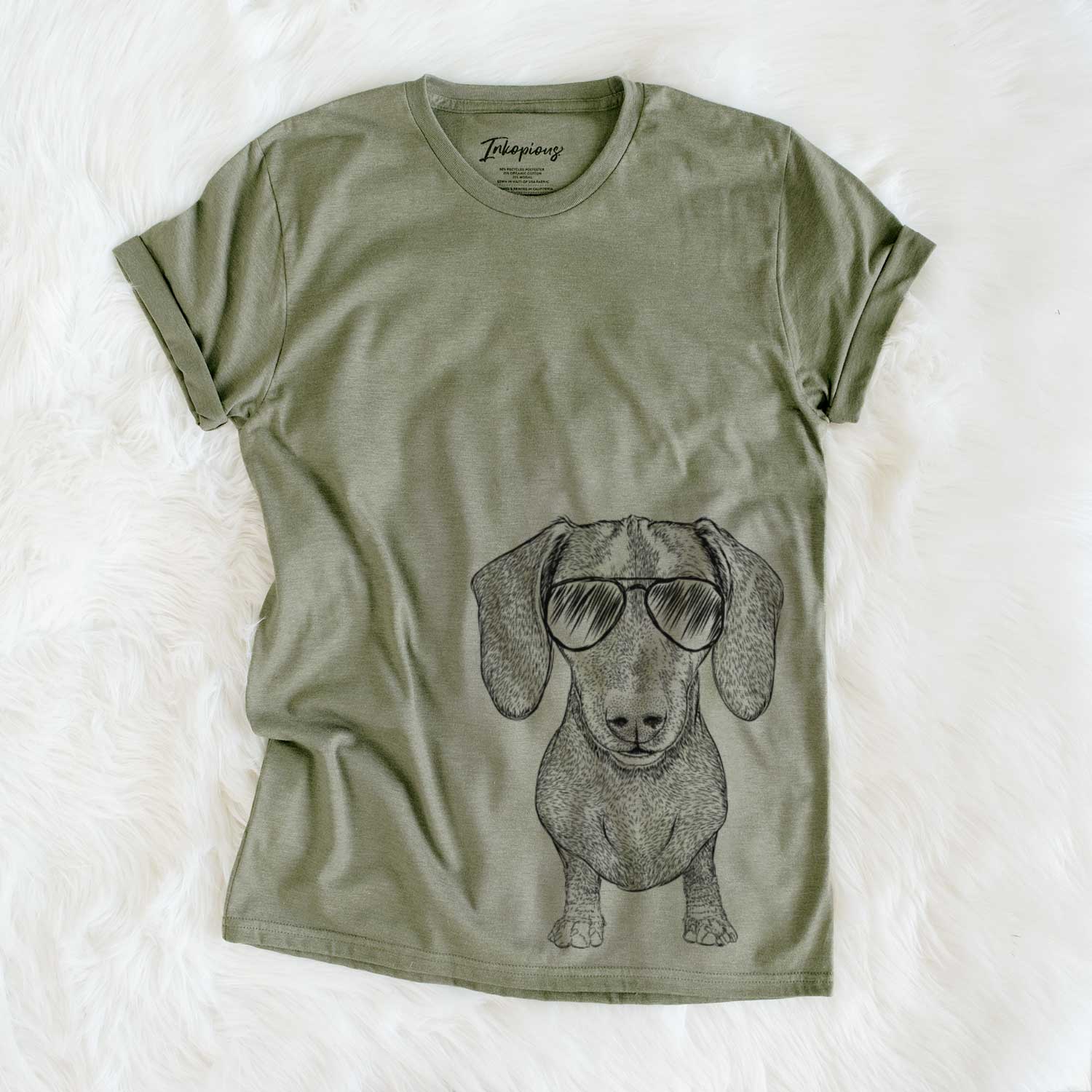 Hand-drawn sketch of Ernie the Mini Dachshund wearing aviator sunglasses on an Olive Unisex crewneck