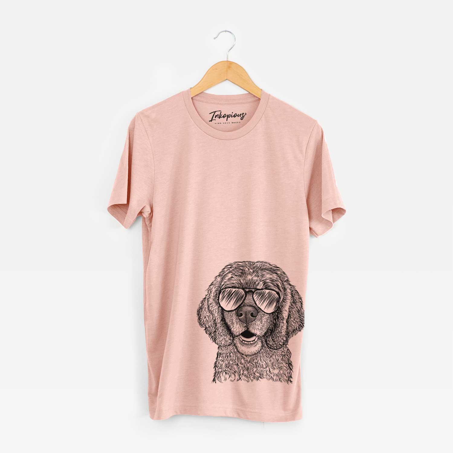 Hand-drawn sketch of Fannie Mae the Cocker Spaniel wearing aviator sunglasses on a Peach Unisex crewneck