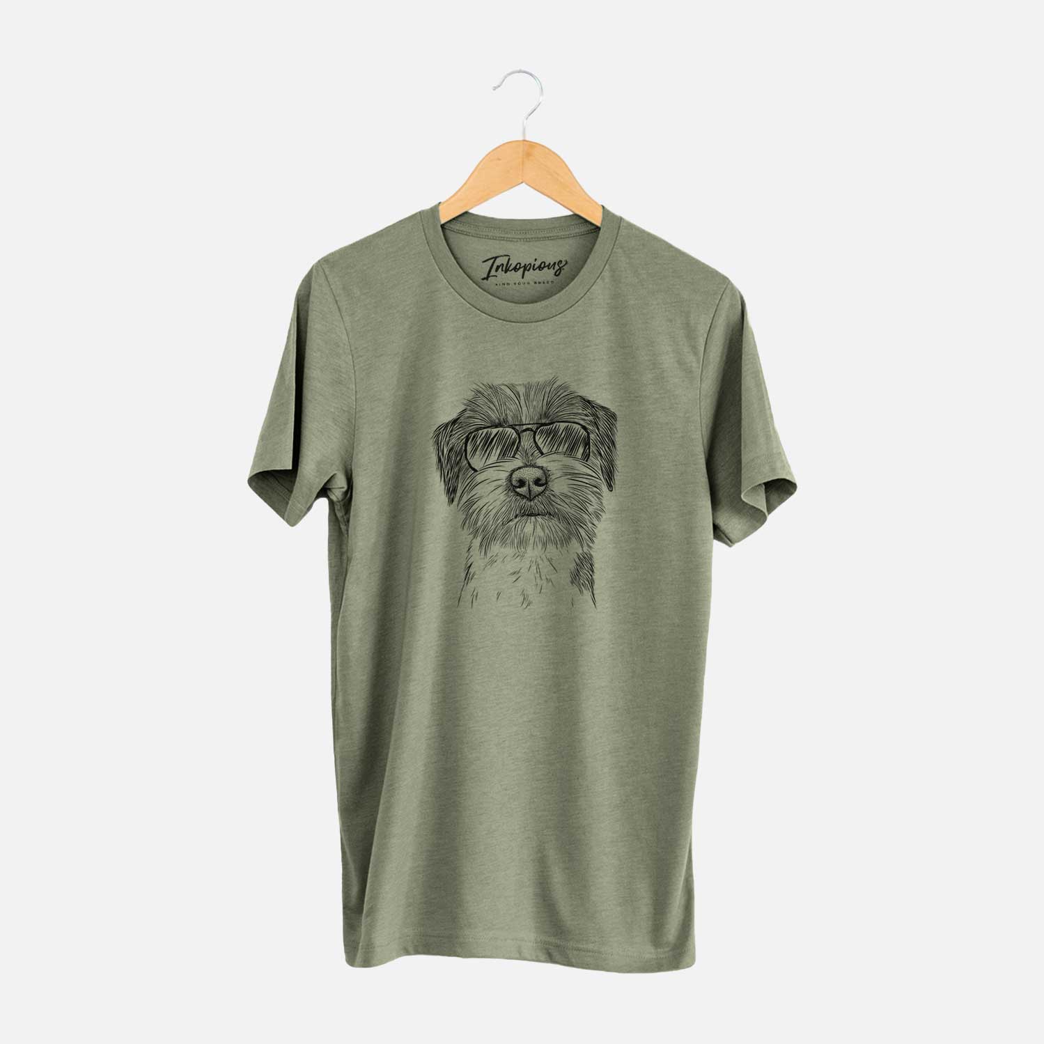Hand-drawn sketch of Feis the Parson Russell Terrier wearing aviator sunglasses on an Olive Unisex crewneck