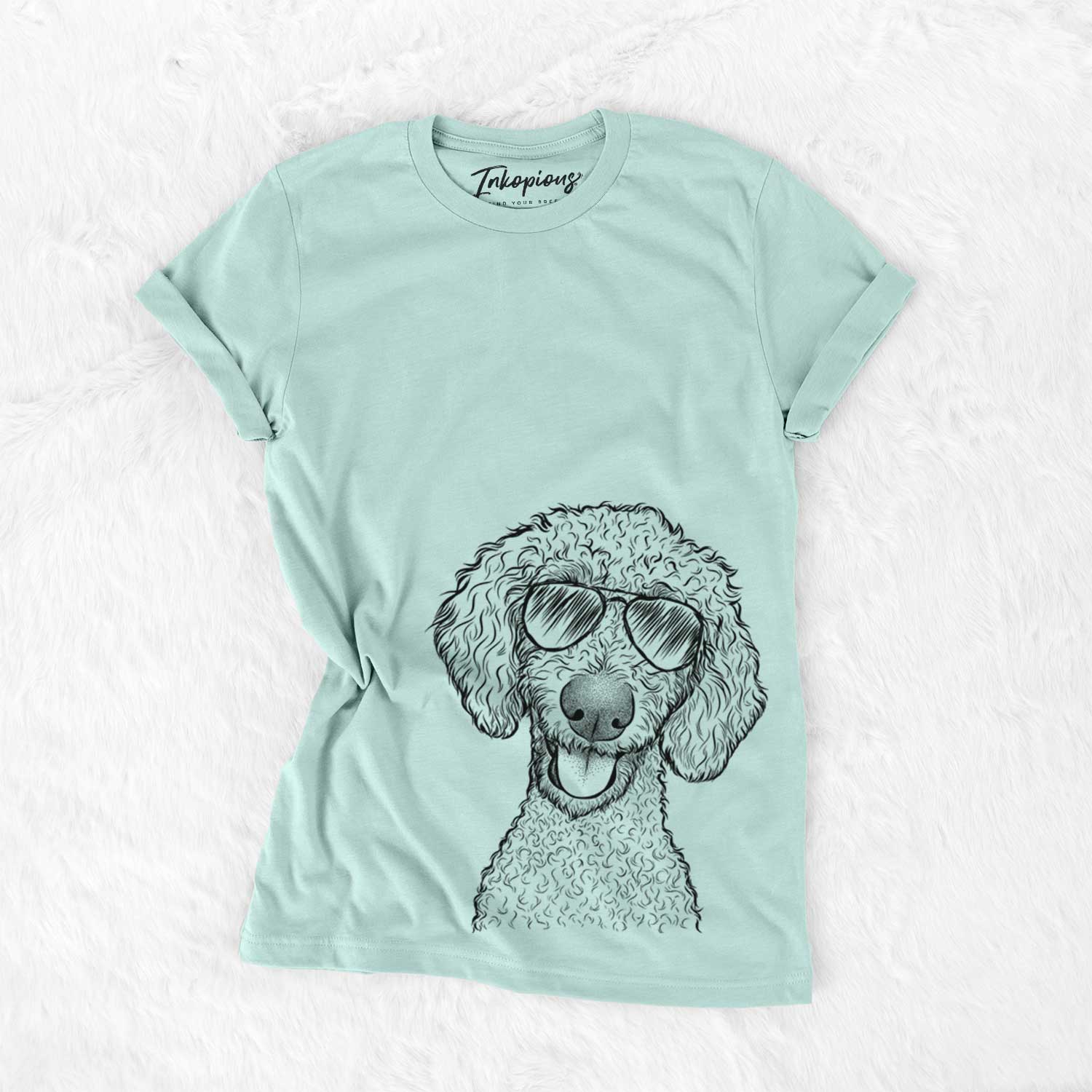 Hand-drawn sketch of Fenway the Goldendoodle wearing aviator sunglasses on a Heather Sage Unisex crewneck