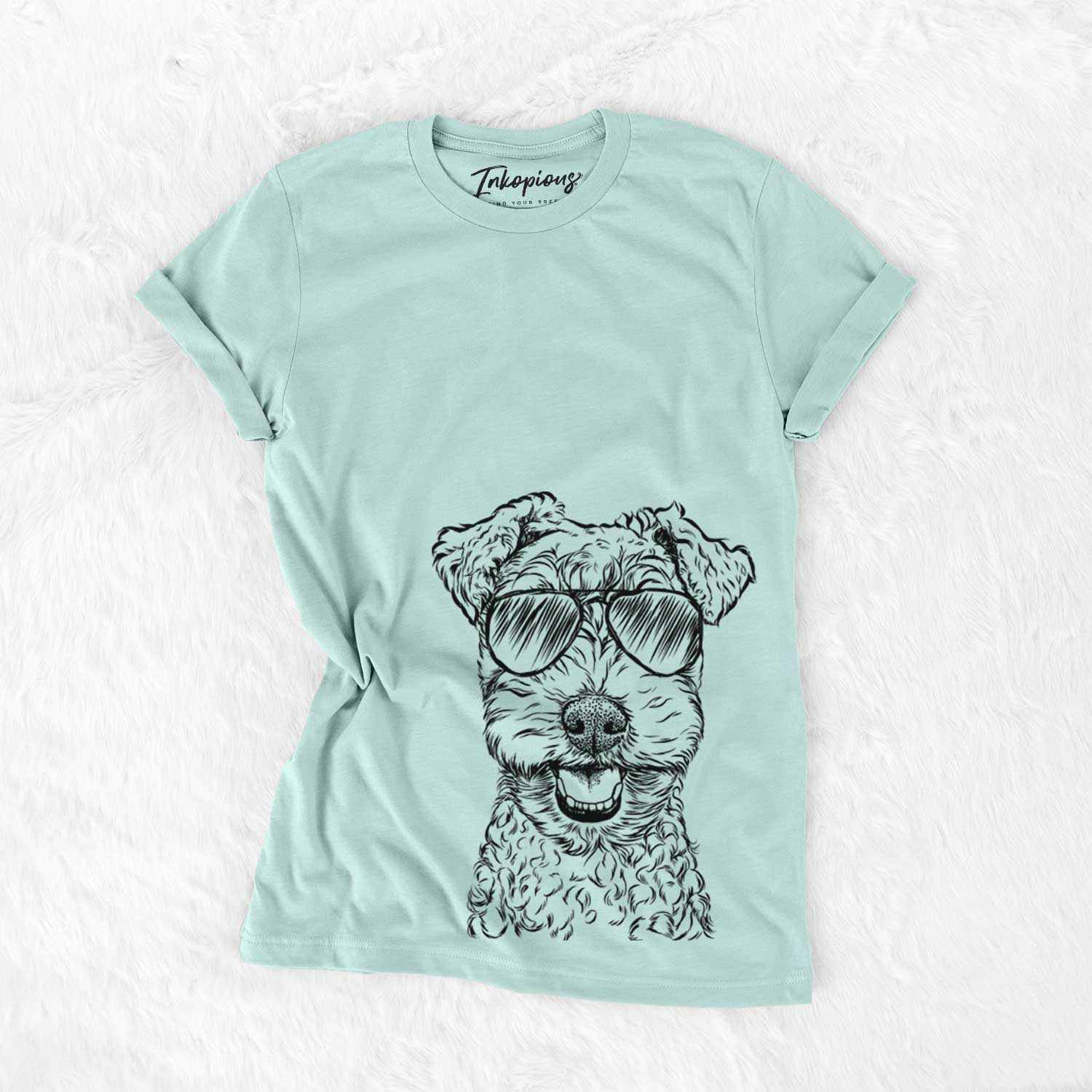 Hand-drawn sketch of Fintan the Irish Troodle wearing aviator sunglasses on a Heather Sage Unisex crewneck