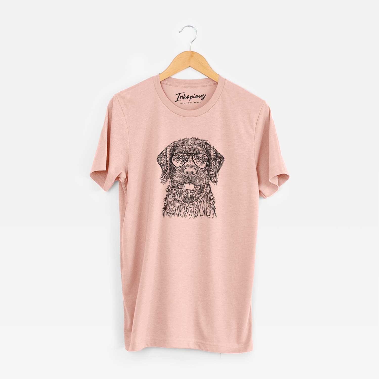 Hand-drawn sketch of Fletcher the Wirehaired Pointing Griffon wearing aviator sunglasses on a Peach Unisex crewneck