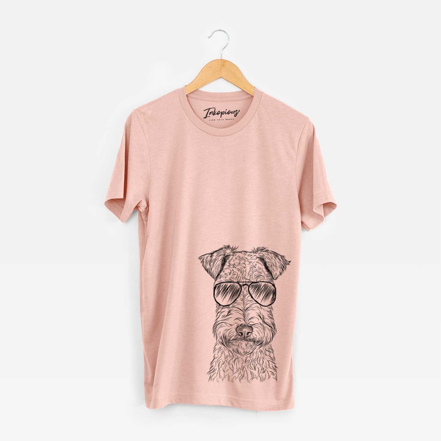 Hand-drawn sketch of Frida the Lakeland Terrier wearing aviator sunglasses on a Peach Unisex crewneck
