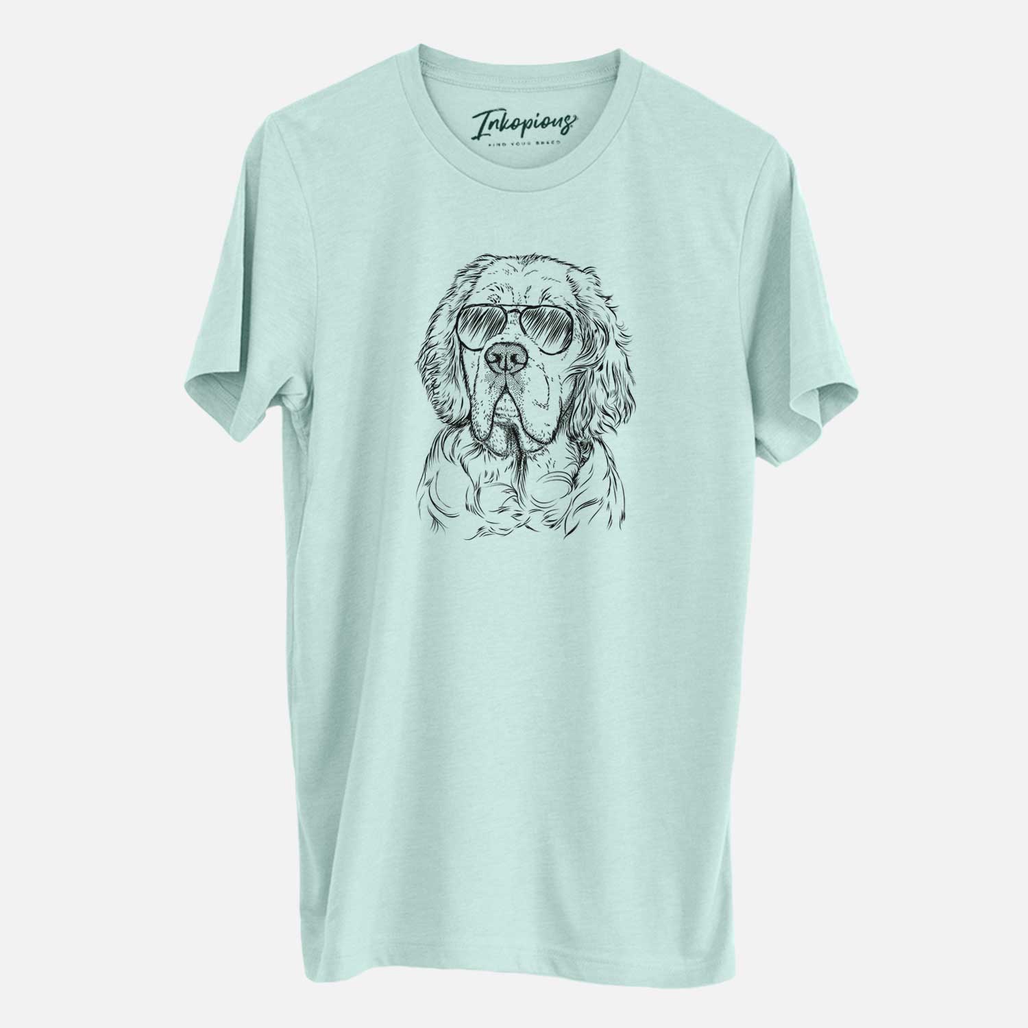 Hand-drawn sketch of Gary the Clumber Spaniel wearing aviator sunglasses on a Heather Sage Unisex crewneck
