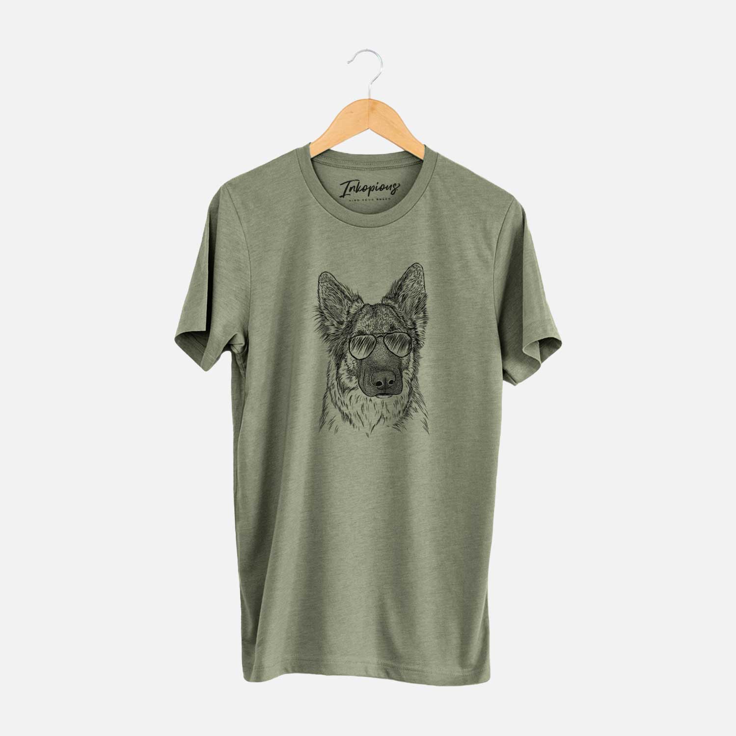 Hand-drawn sketch of Geddy the Shiloh Shepherd wearing aviator sunglasses on an Olive Unisex crewneck