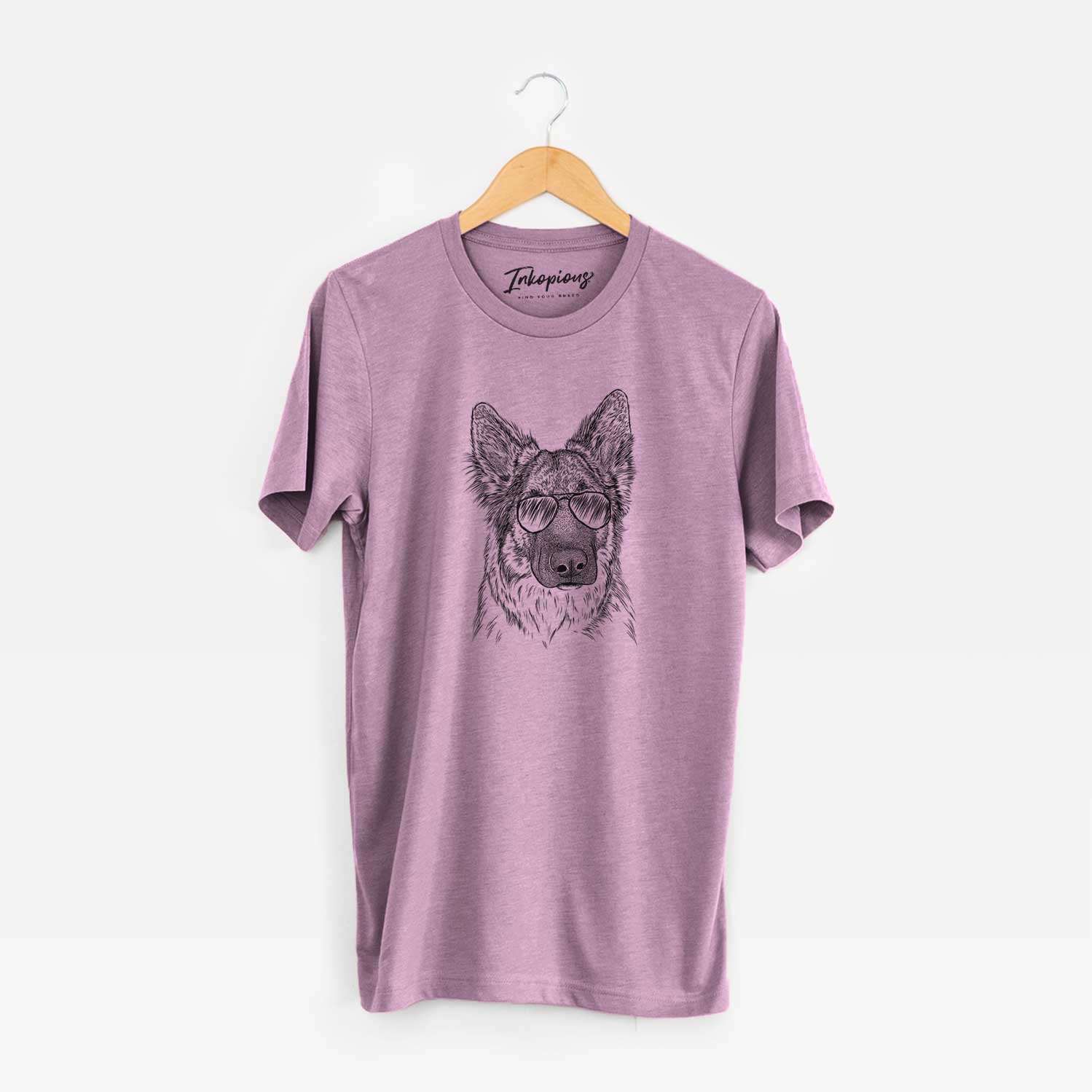 Hand-drawn sketch of Geddy the Shiloh Shepherd wearing aviator sunglasses on an Orchid Unisex crewneck