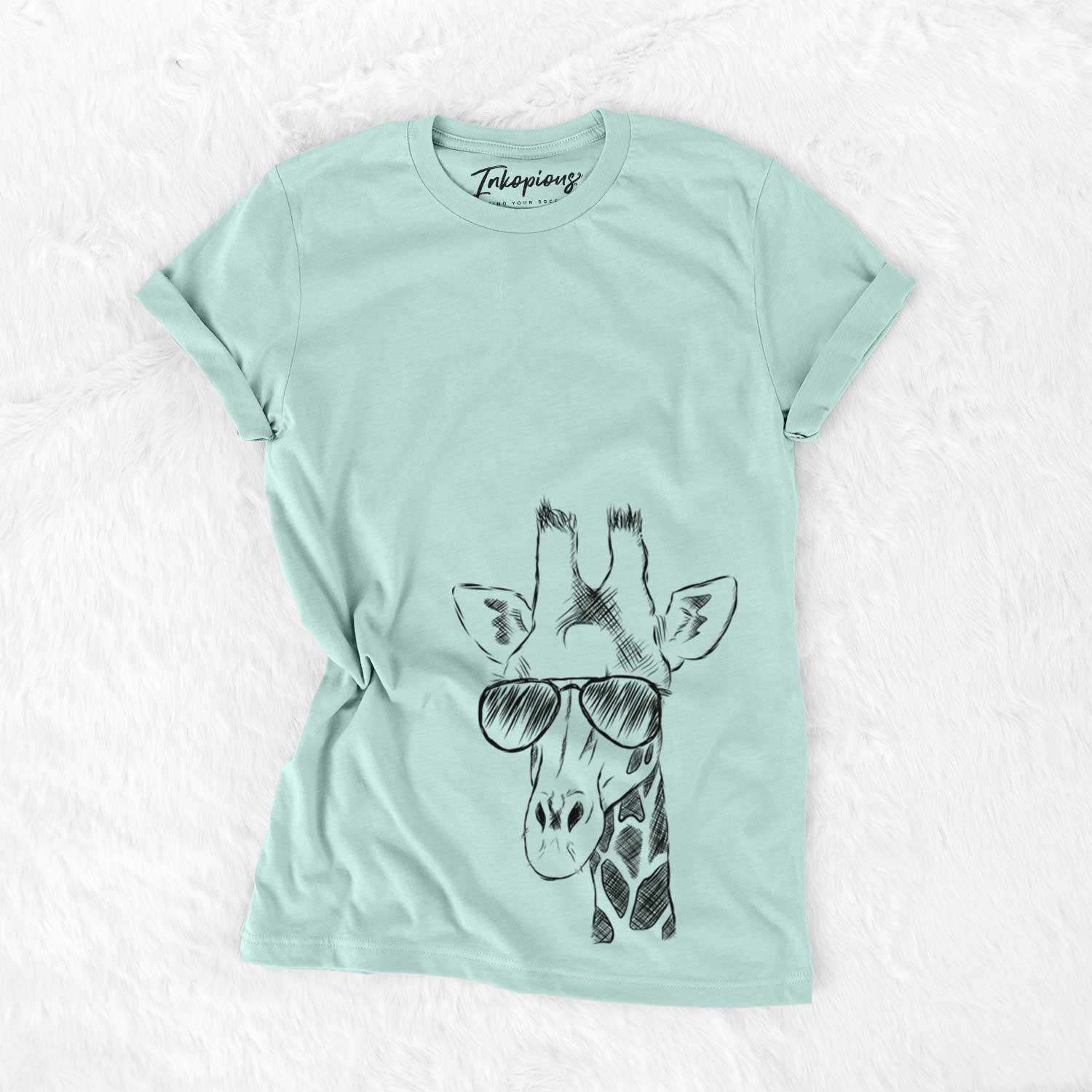 Hand-drawn sketch of Geoffrey the Giraffe wearing aviator sunglasses on a Heather Sage Unisex crewneck