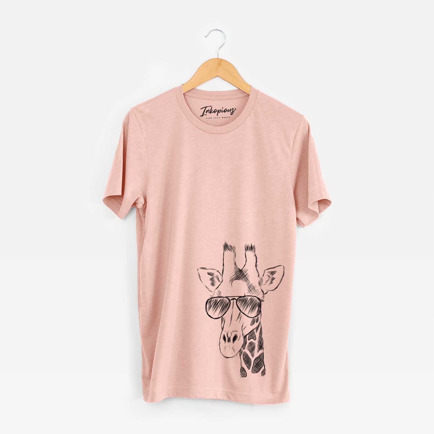 Hand-drawn sketch of Geoffrey the Giraffe wearing aviator sunglasses on a Peach Unisex crewneck